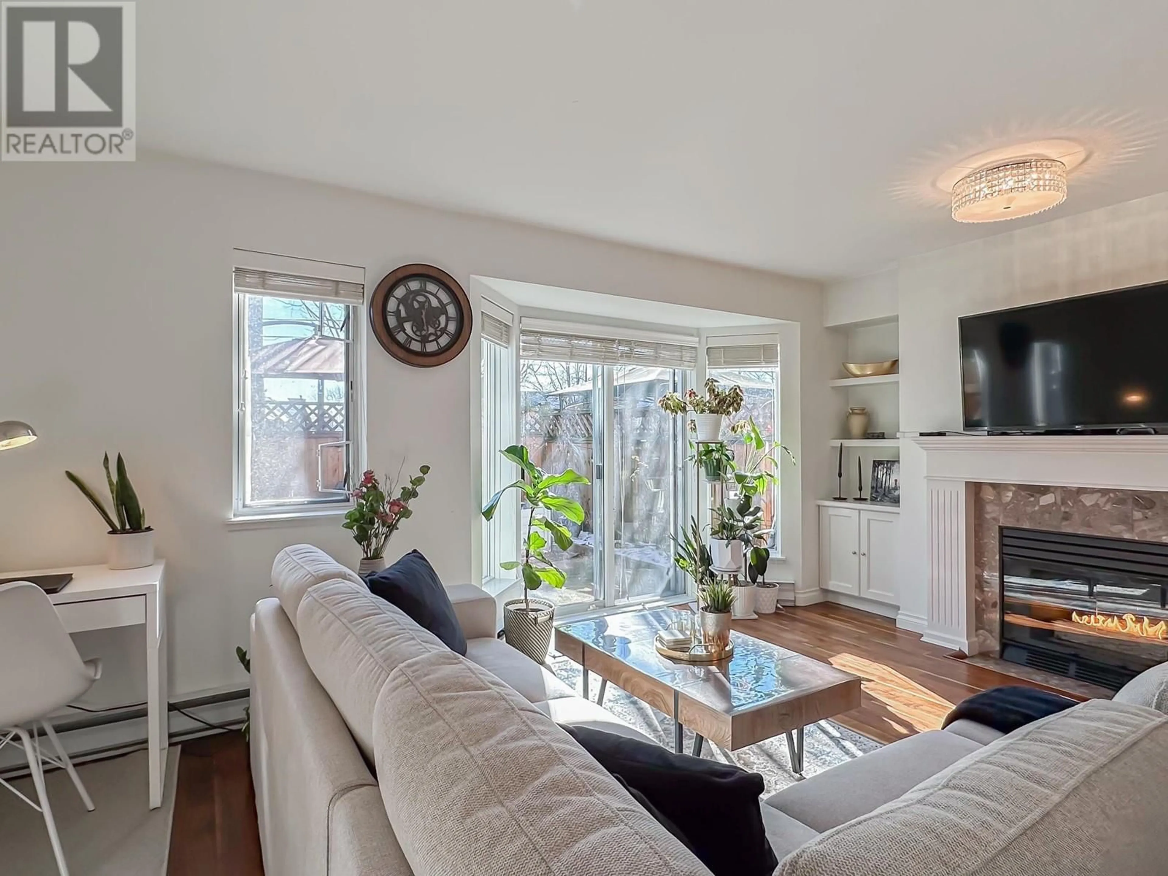 Living room with furniture, wood/laminate floor for 2 1215 BRUNETTE AVENUE, Coquitlam British Columbia V3K6W2