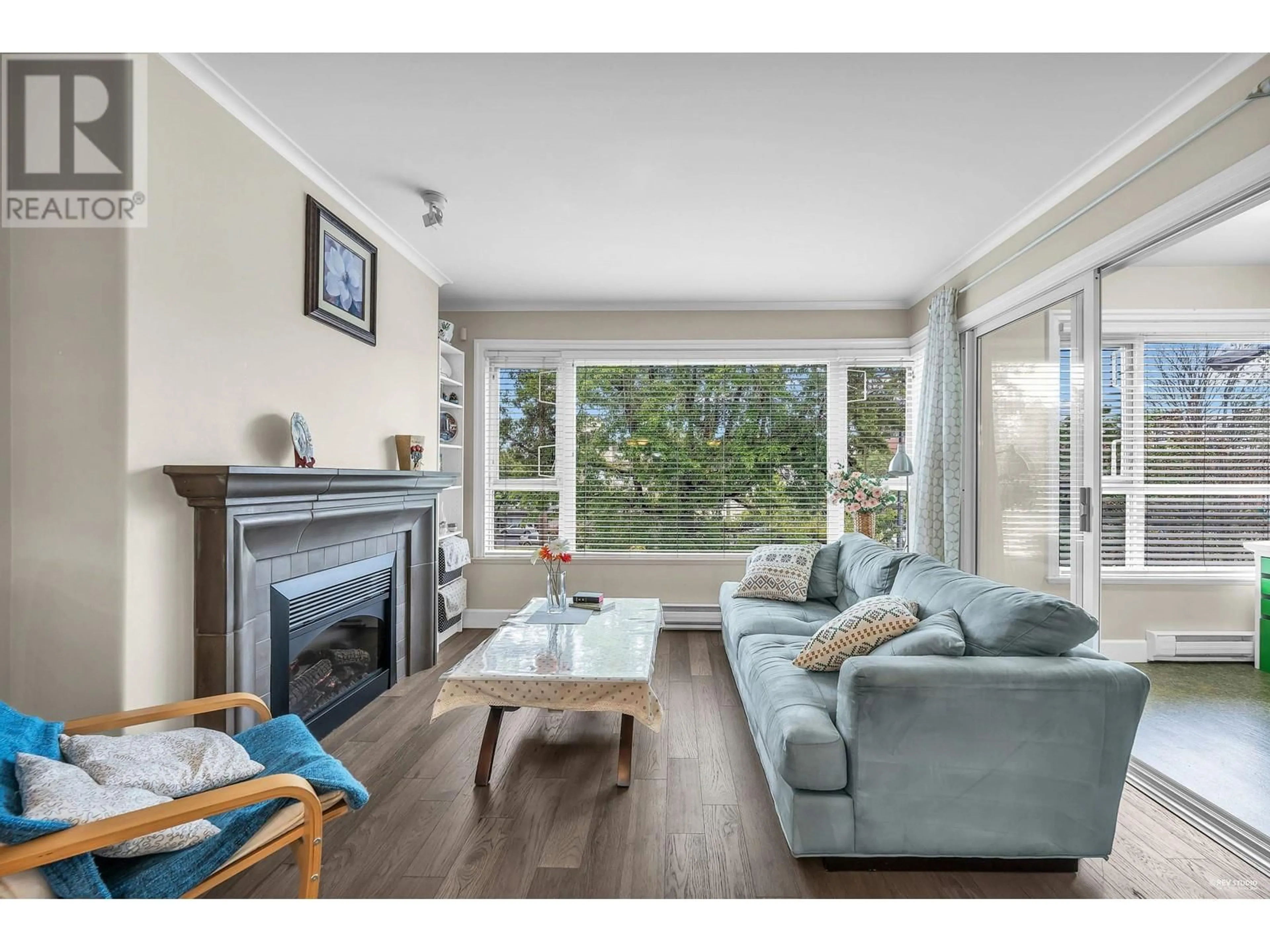 Living room with furniture, wood/laminate floor for 301 2103 W 45TH AVENUE, Vancouver British Columbia V6M2J2