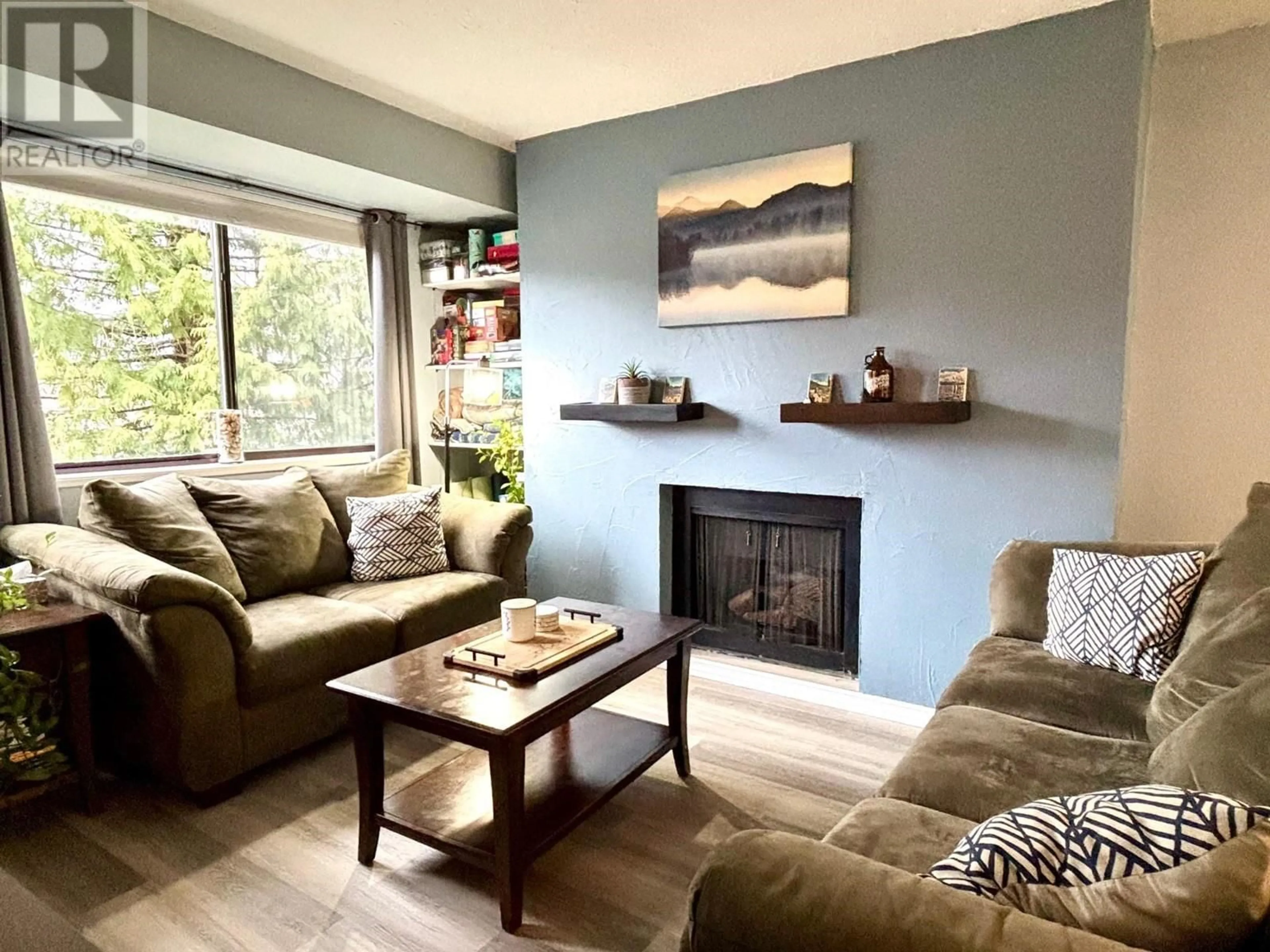 Living room with furniture, wood/laminate floor for 12 4832 LAZELLE AVENUE, Terrace British Columbia V8G1T4