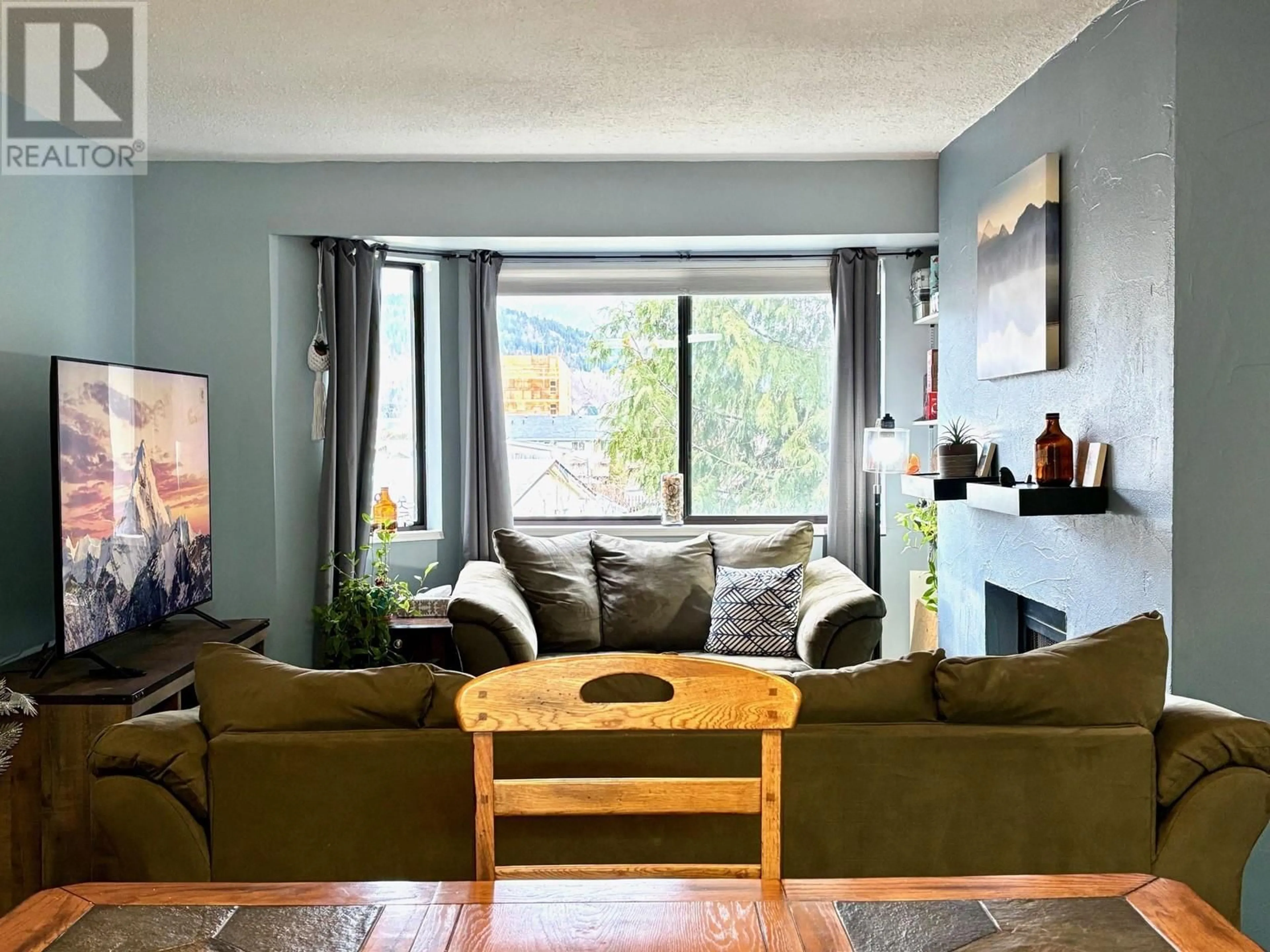 Living room with furniture, wood/laminate floor for 12 4832 LAZELLE AVENUE, Terrace British Columbia V8G1T4