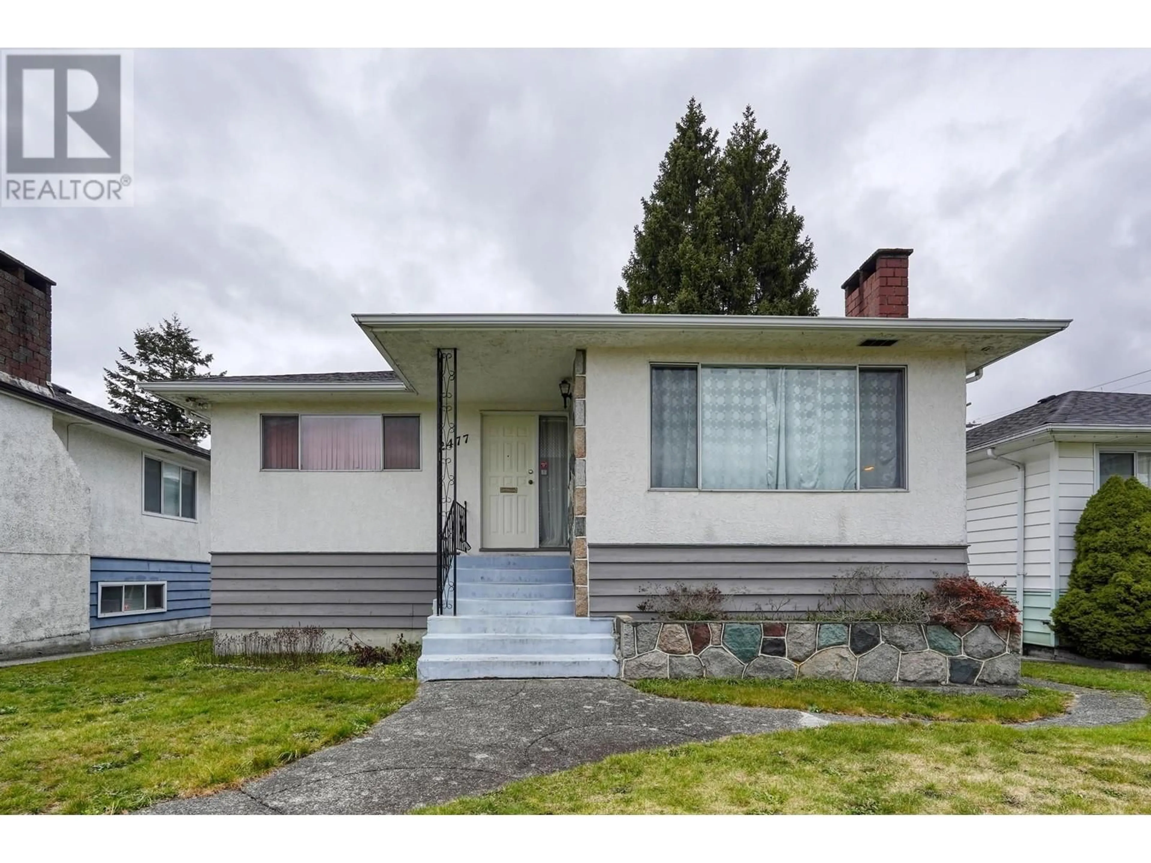 Home with vinyl exterior material, street for 2477 E 53RD AVENUE, Vancouver British Columbia V5S1V7