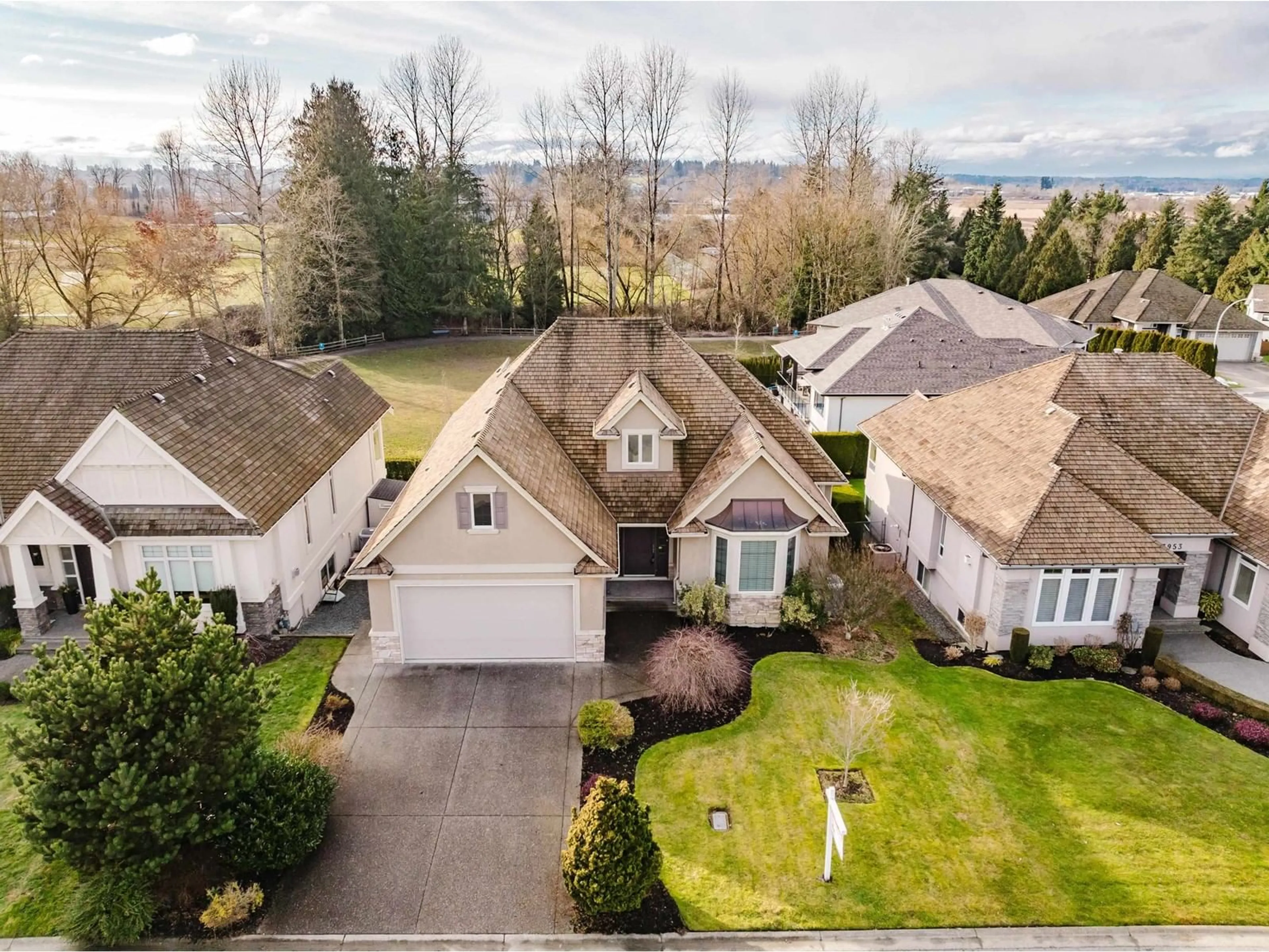 A pic from outside/outdoor area/front of a property/back of a property/a pic from drone, street for 3943 COACHSTONE WAY, Abbotsford British Columbia V2S8G6