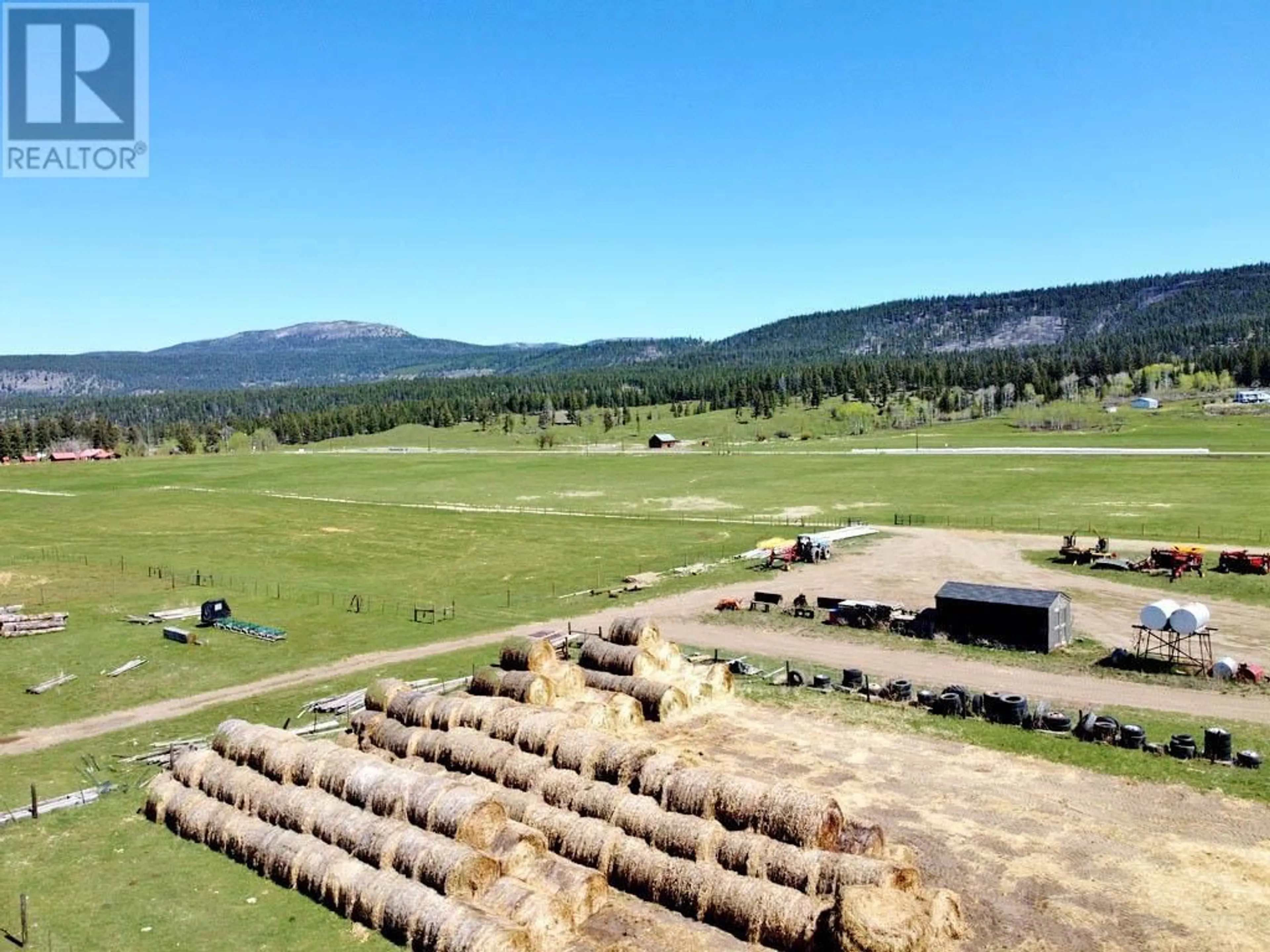 A pic from outside/outdoor area/front of a property/back of a property/a pic from drone, mountain view for 6547 20 HIGHWAY, Chilcotin British Columbia V0L1K0