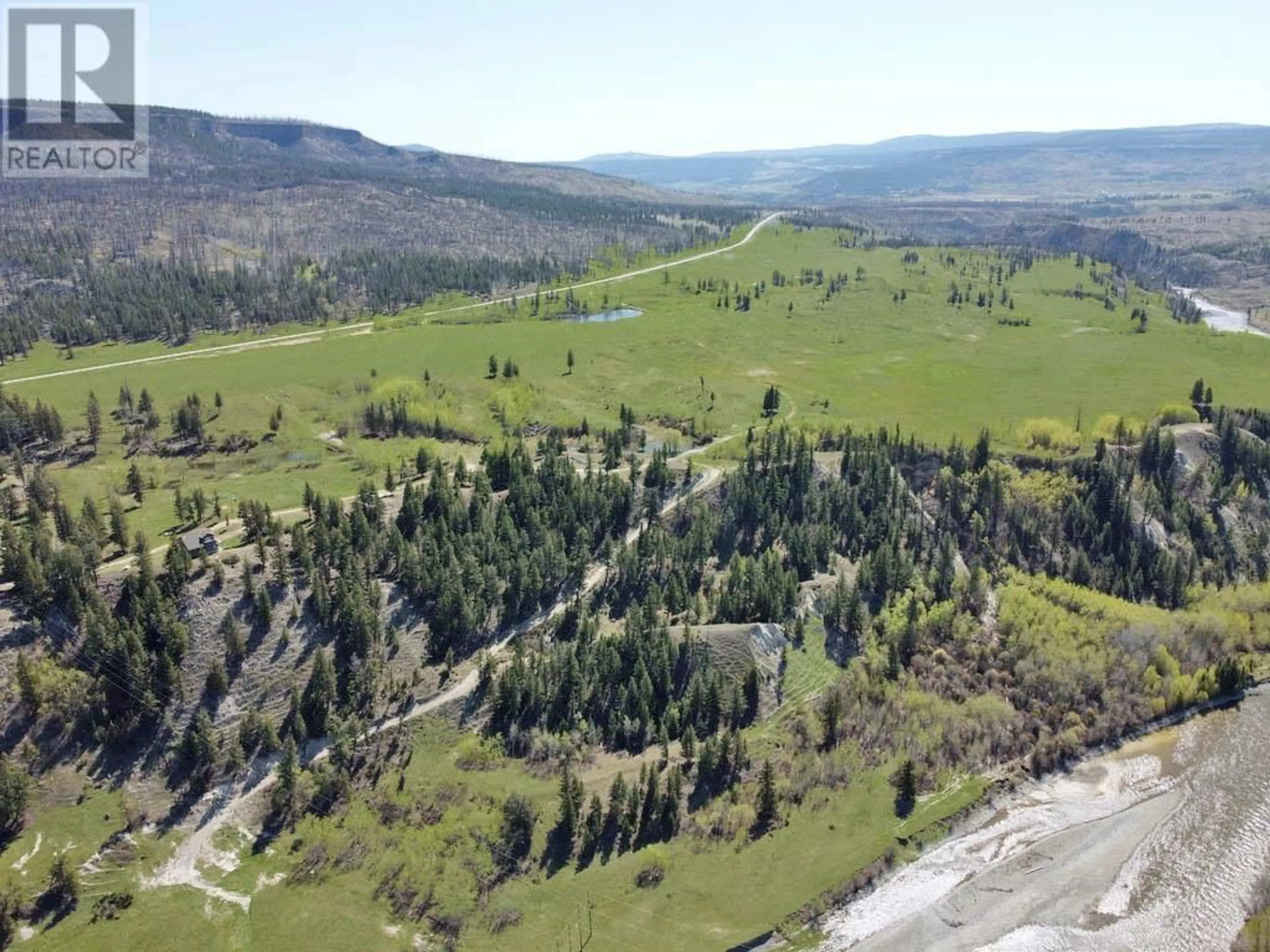 A pic from outside/outdoor area/front of a property/back of a property/a pic from drone, mountain view for 6547 20 HIGHWAY, Chilcotin British Columbia V0L1K0