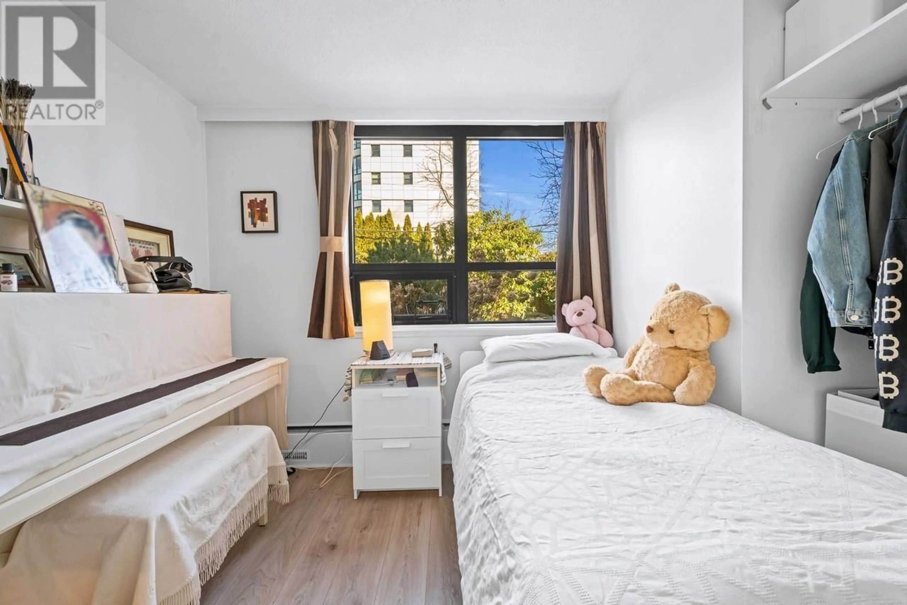 Bedroom with bed, wood/laminate floor for 104 - 5350 BALSAM STREET, Vancouver British Columbia V6M4B4