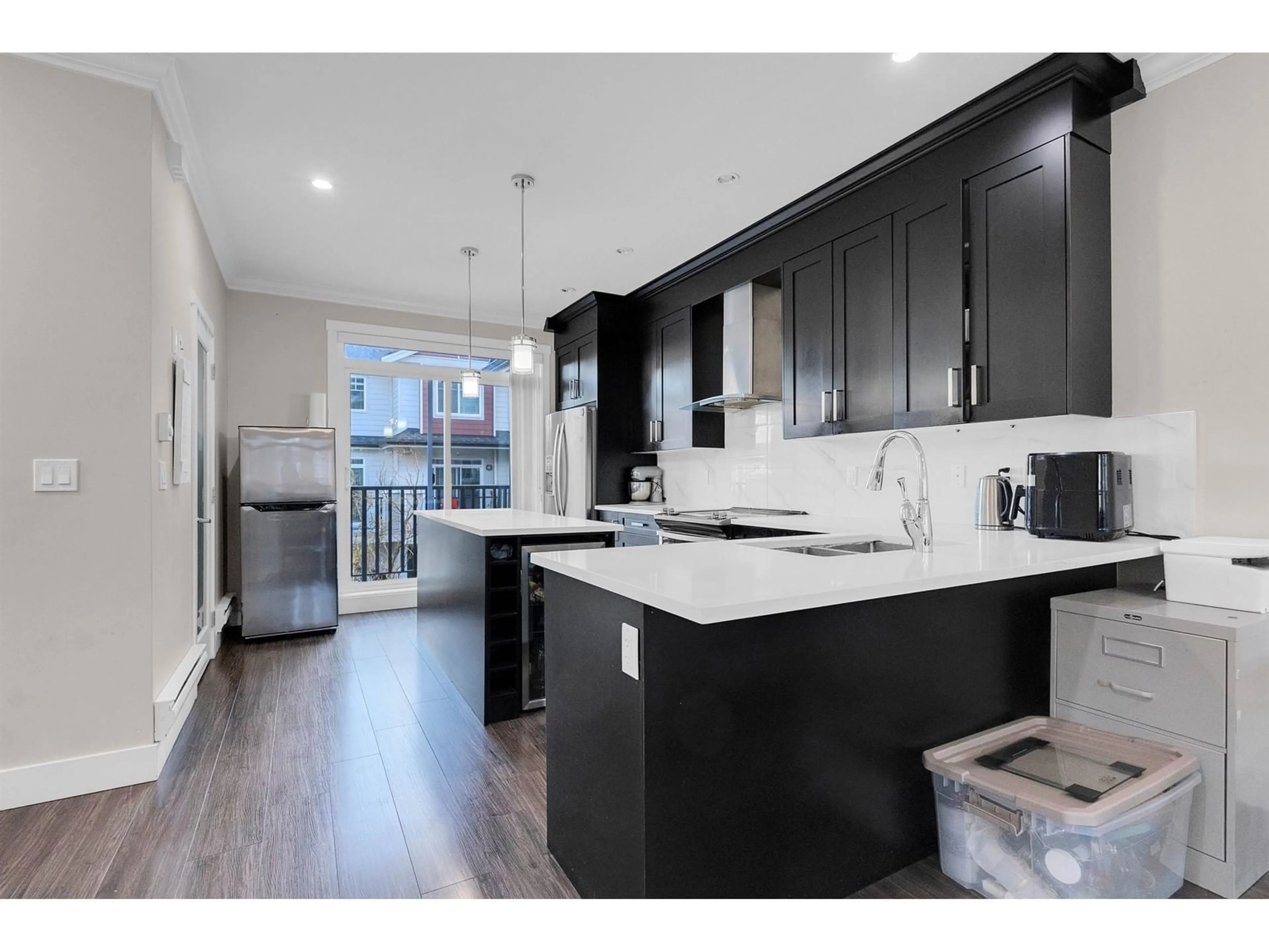 Open concept kitchen, wood/laminate floor for 113 13898 64 AVENUE, Surrey British Columbia V3W1L6