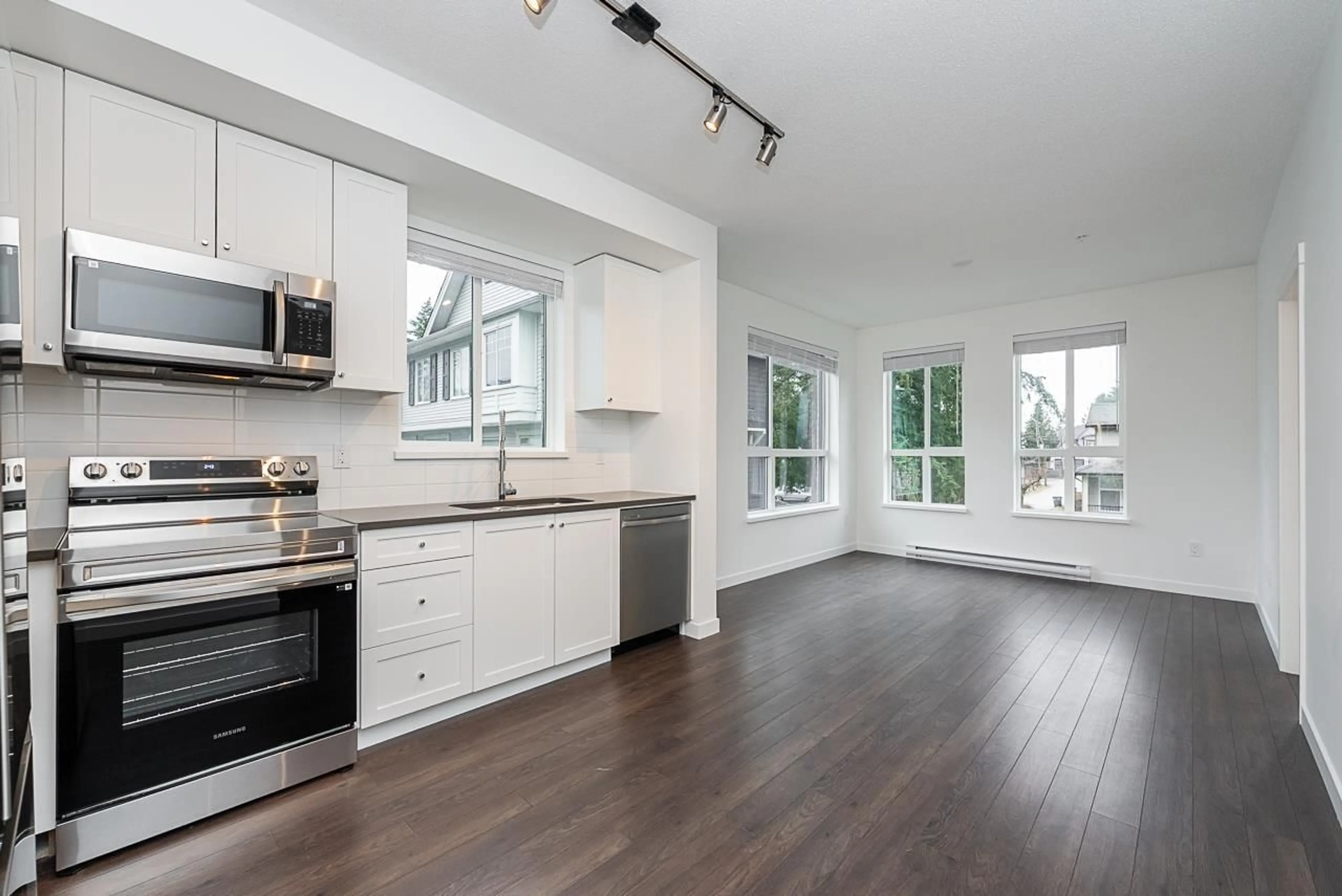 Open concept kitchen, wood/laminate floor for 214 15738 85 AVENUE, Surrey British Columbia V4N6Y1