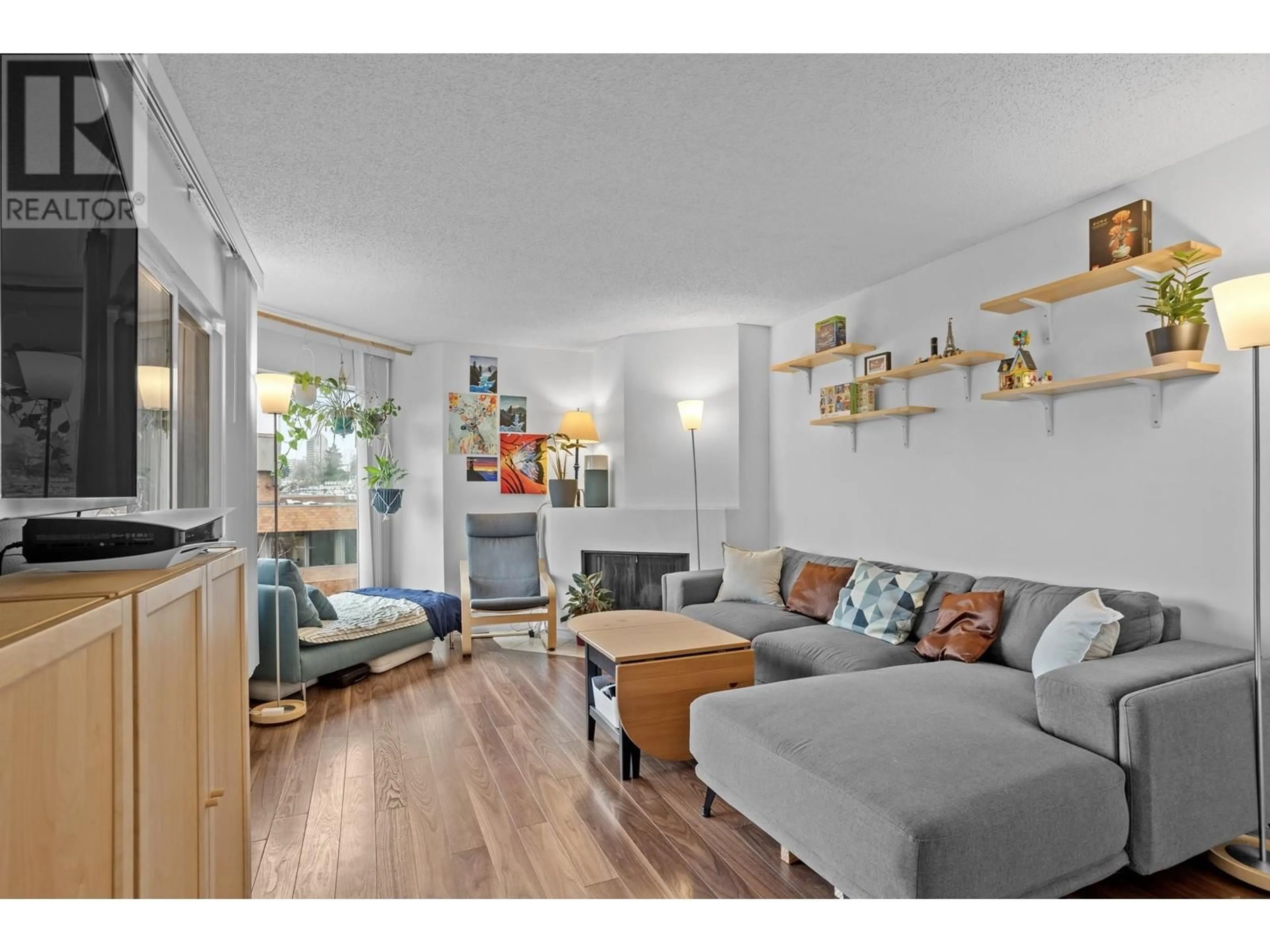 Living room with furniture, wood/laminate floor for 311 1345 W 4TH AVENUE, Vancouver British Columbia V6H3Y8