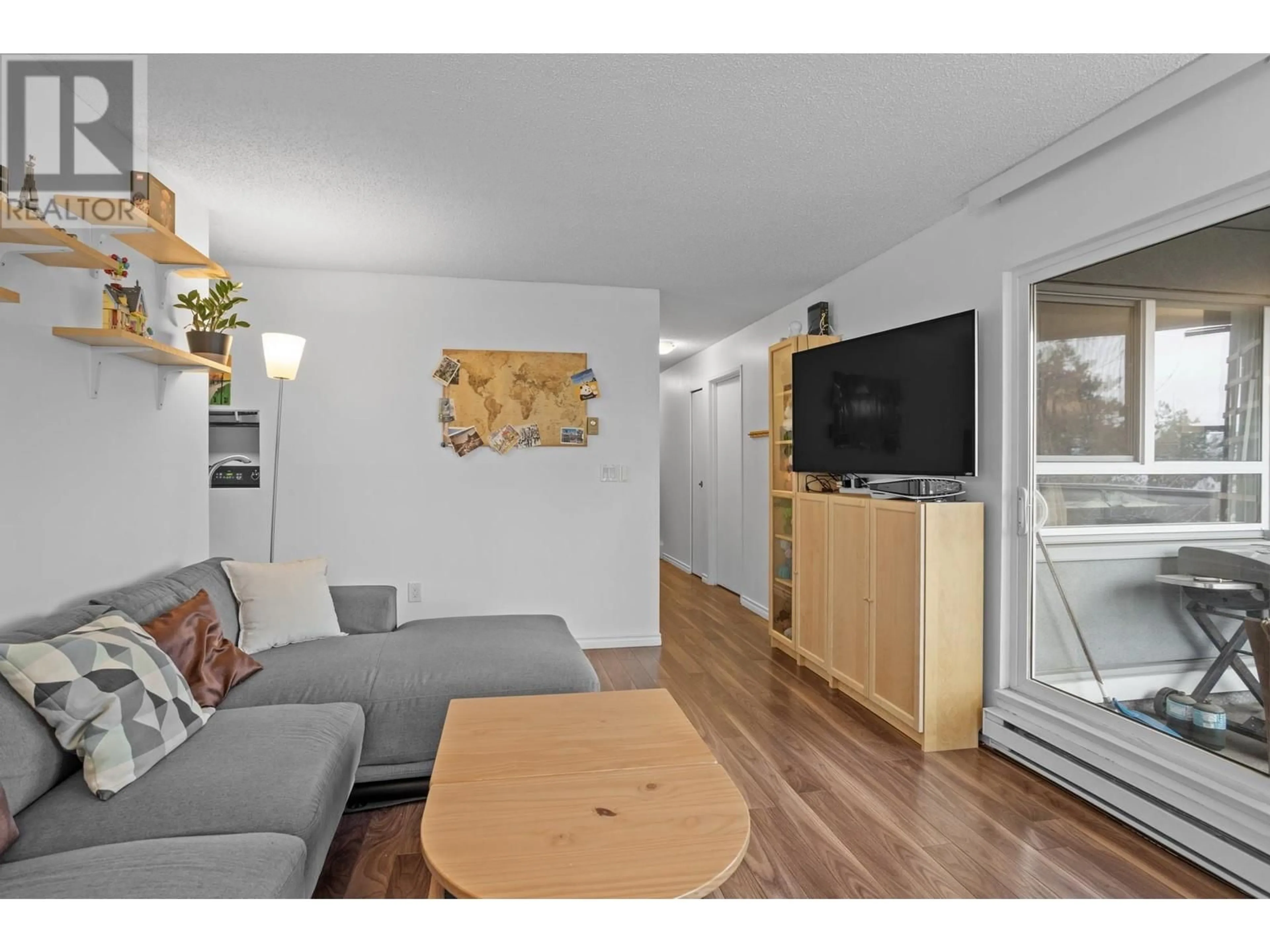 Living room with furniture, wood/laminate floor for 311 1345 W 4TH AVENUE, Vancouver British Columbia V6H3Y8