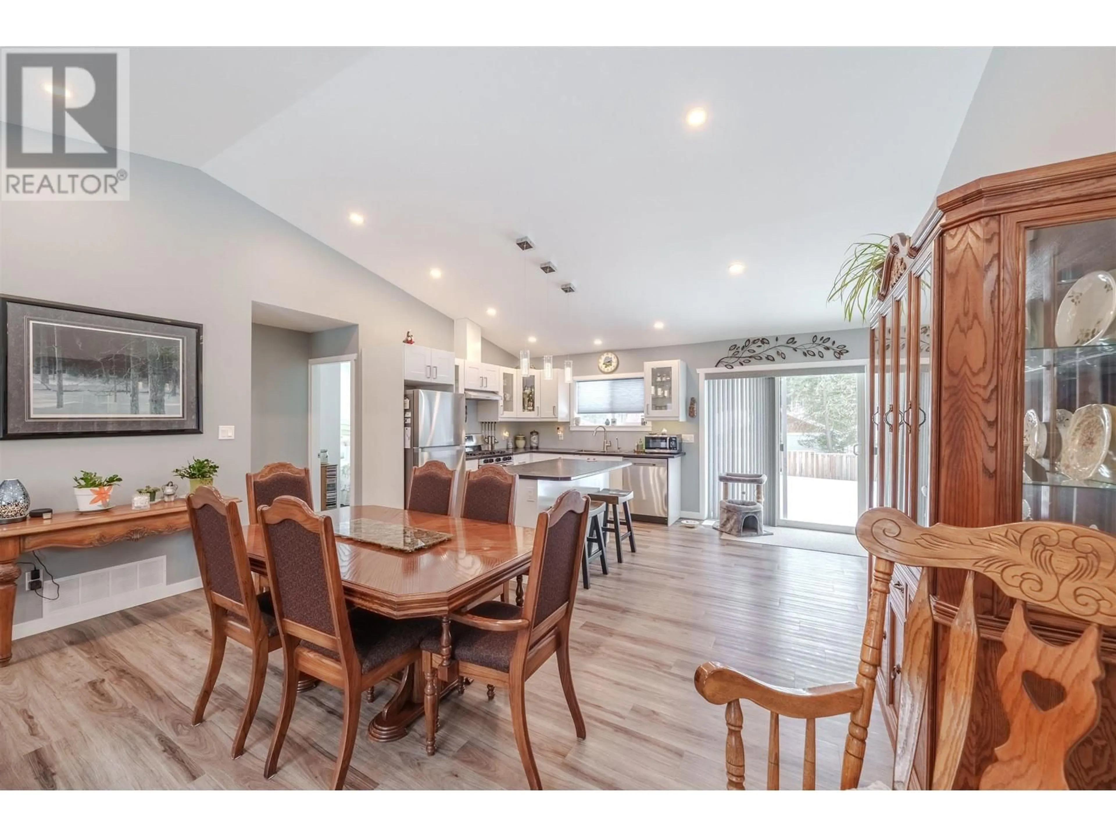 Open concept kitchen, wood/laminate floor for 5099 EASZEE DRIVE, 108 Mile Ranch British Columbia V0K2Z0