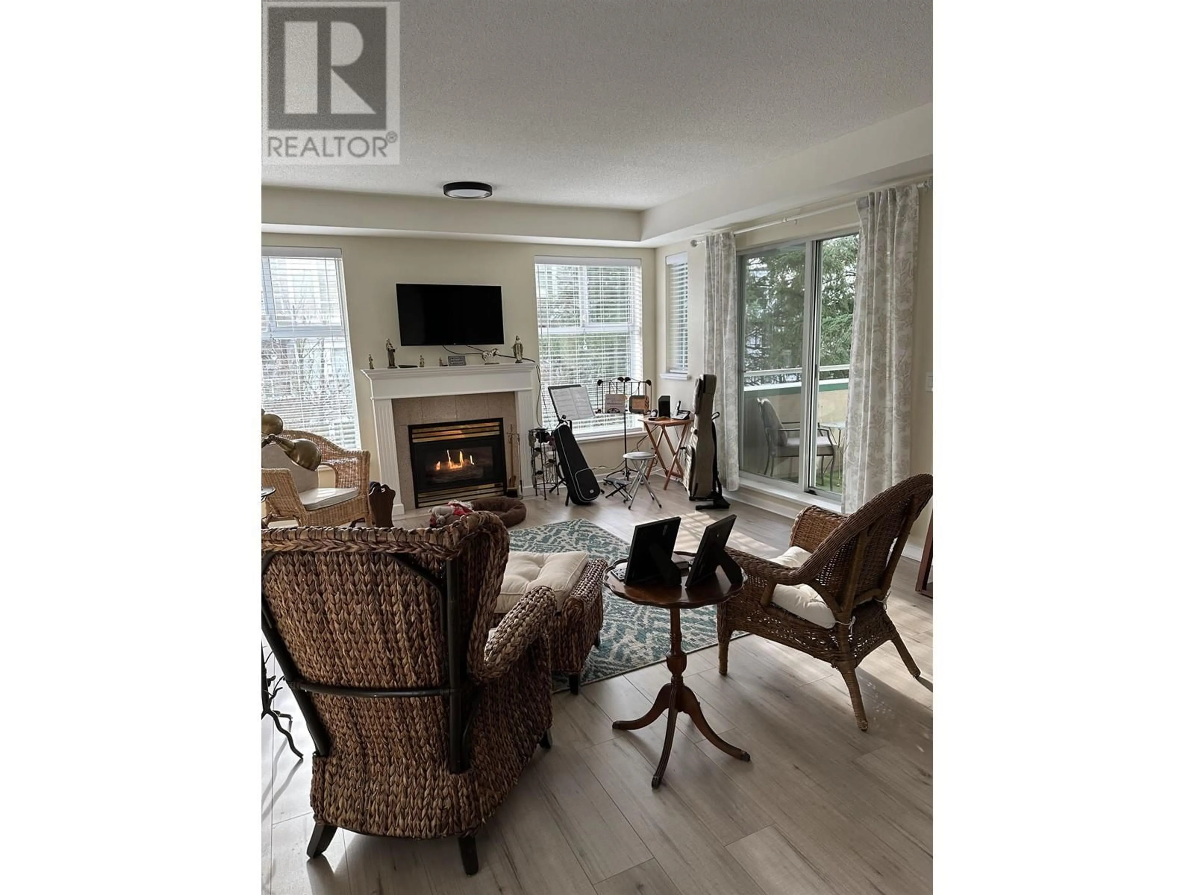 Living room with furniture, wood/laminate floor for 314 11609 227 STREET, Maple Ridge British Columbia V2X2L9