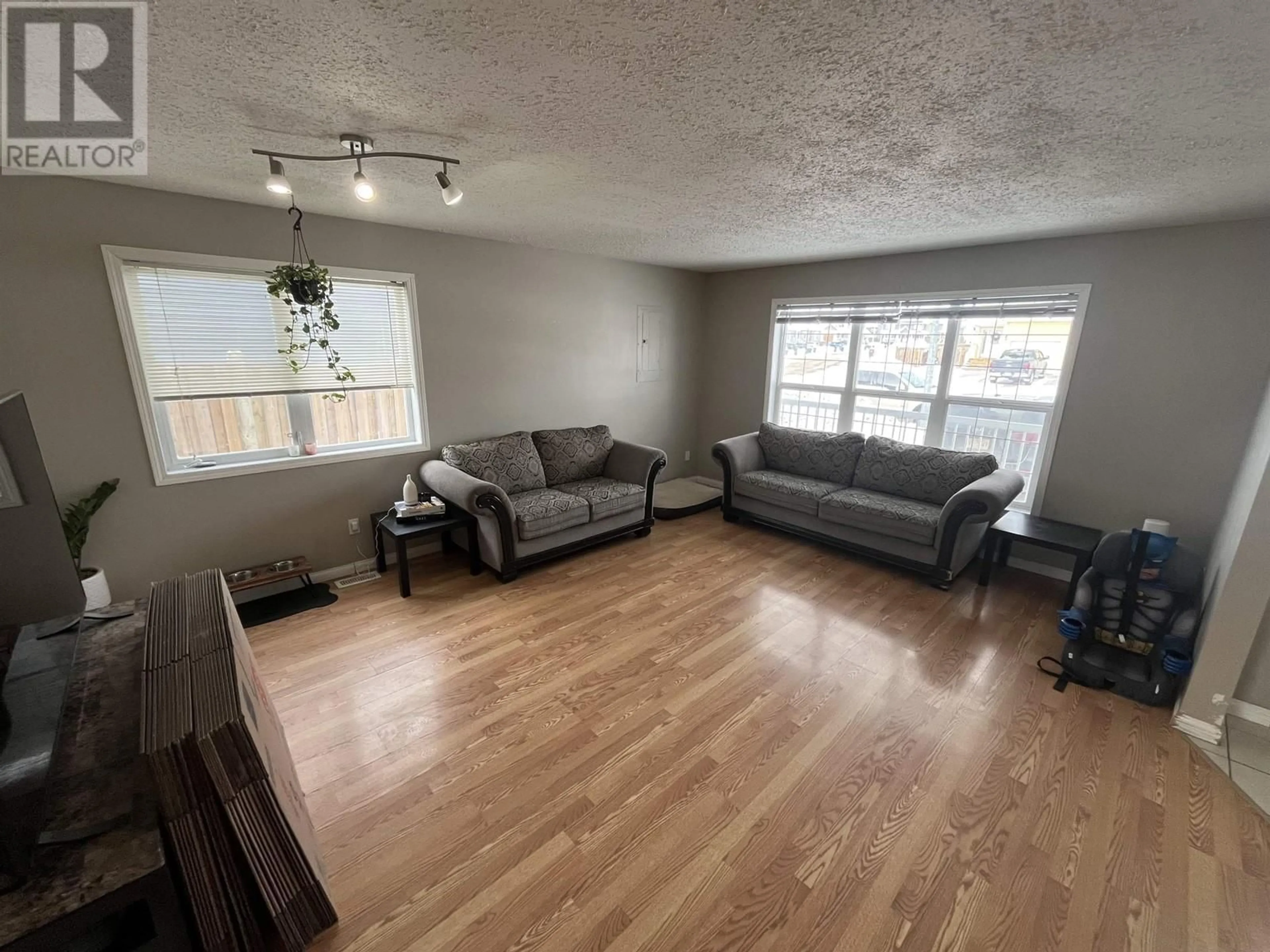 Living room with furniture, unknown for 8335 86 AVENUE, Fort St. John British Columbia V1J0G4