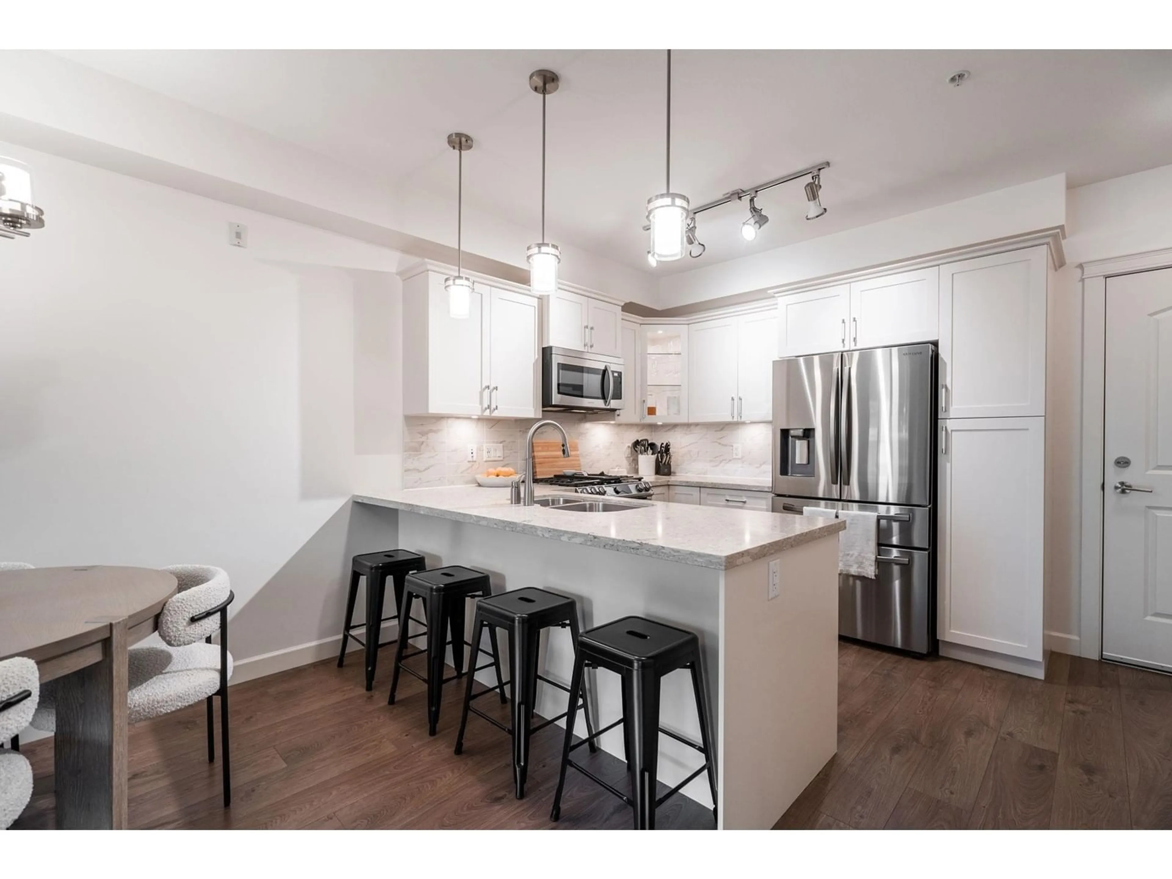 Open concept kitchen, unknown for 211 3535 146A STREET, Surrey British Columbia V4P0H2