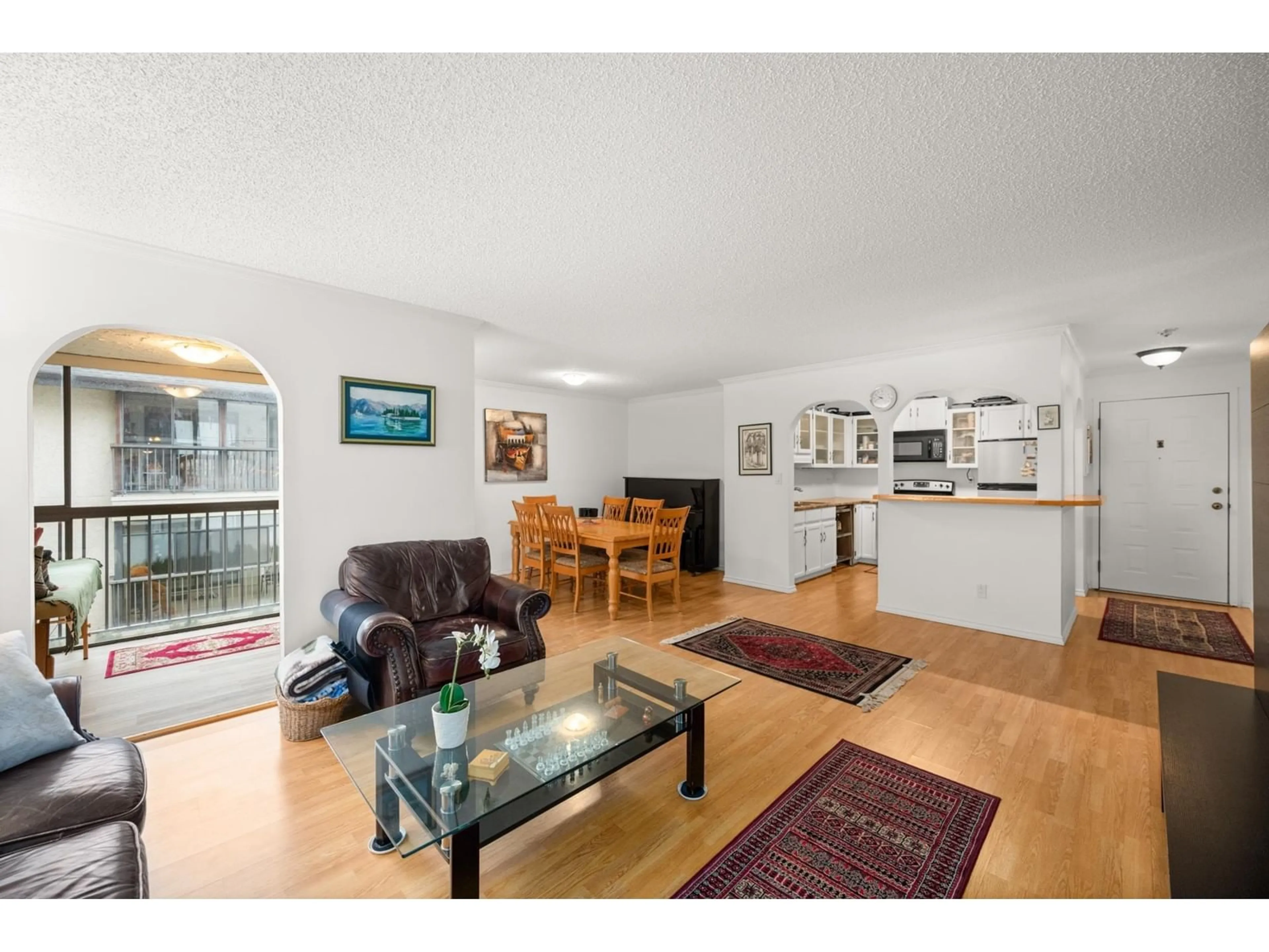 Living room with furniture, wood/laminate floor for 212 1520 VIDAL STREET, White Rock British Columbia V4B3T7