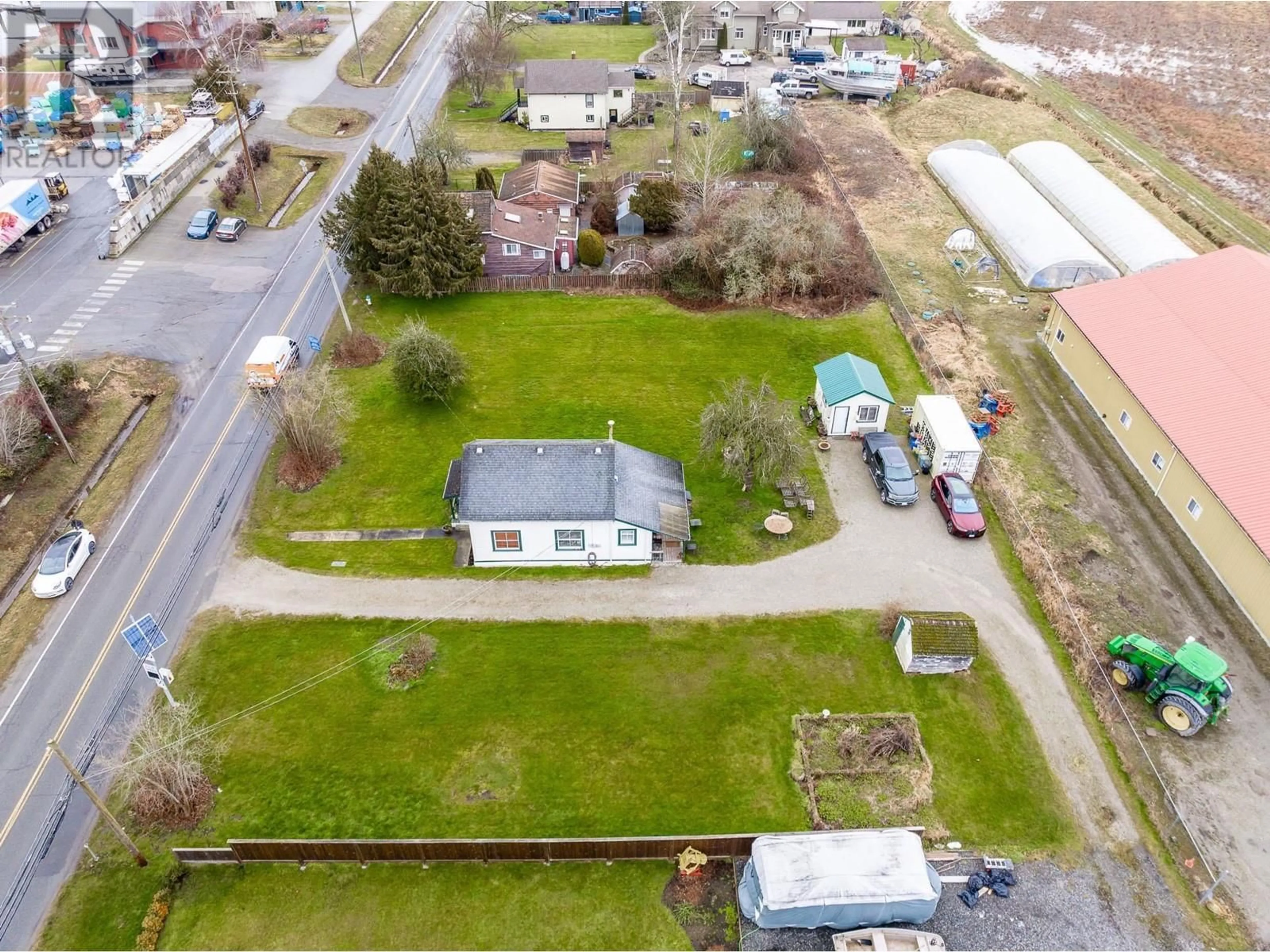 A pic from outside/outdoor area/front of a property/back of a property/a pic from drone, street for 4190 RIVER ROAD, Delta British Columbia V4K1S1