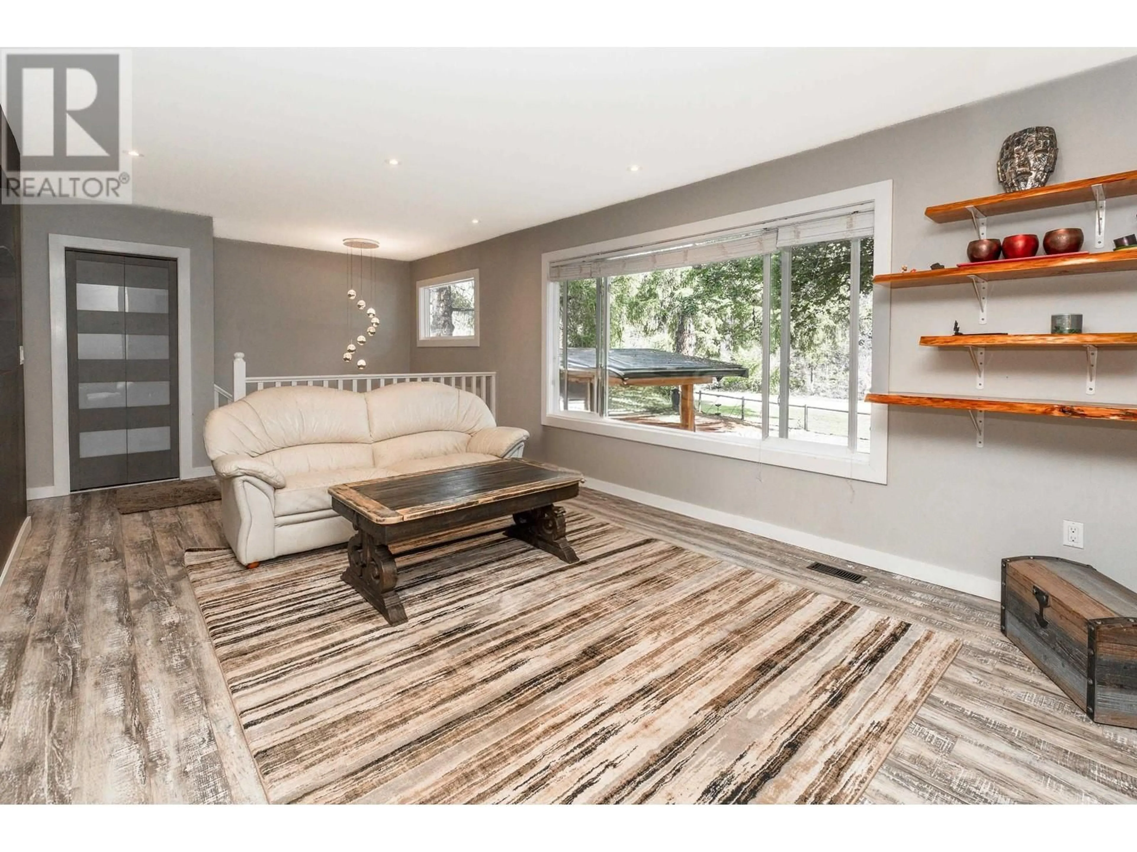 Living room with furniture, wood/laminate floor for 10069 276 STREET, Maple Ridge British Columbia V2W1R5