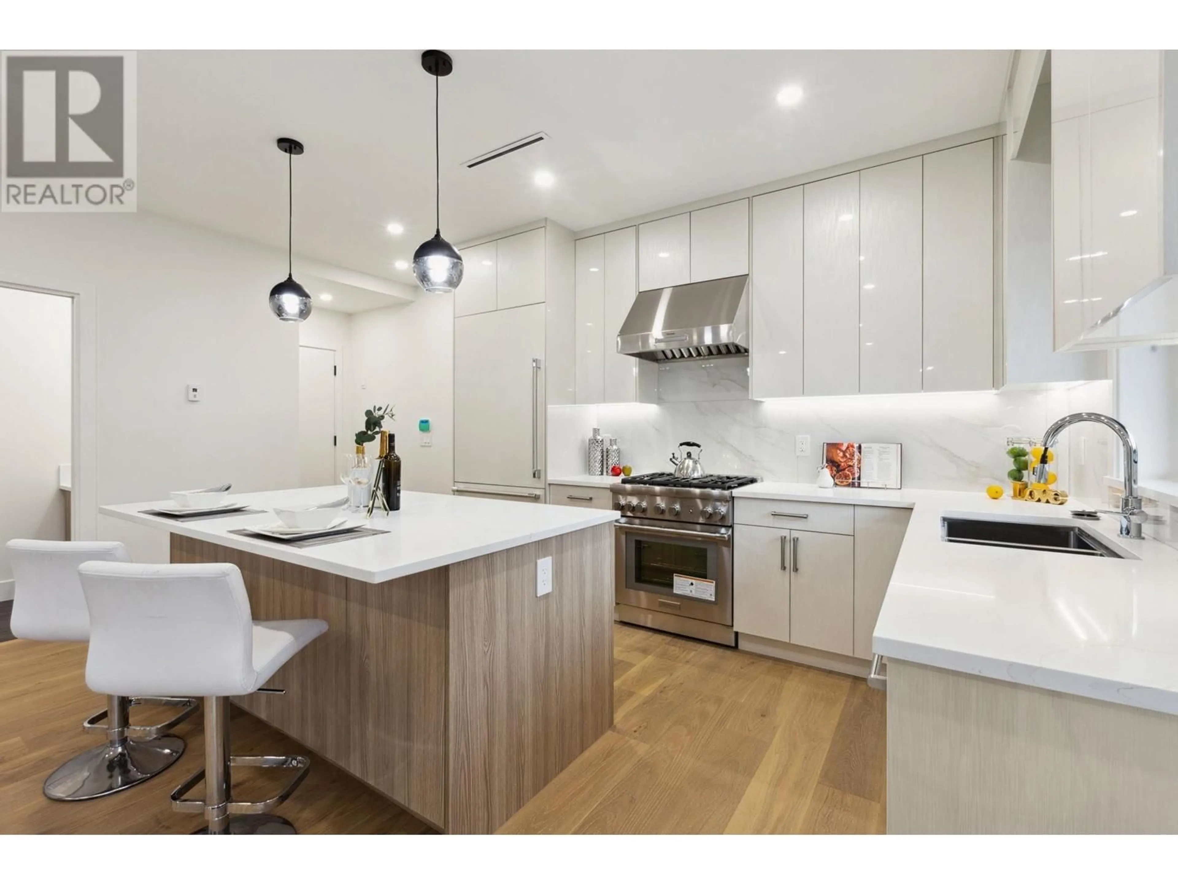 Contemporary kitchen, wood/laminate floor for 2727 W 7TH AVENUE, Vancouver British Columbia V6K1Z3