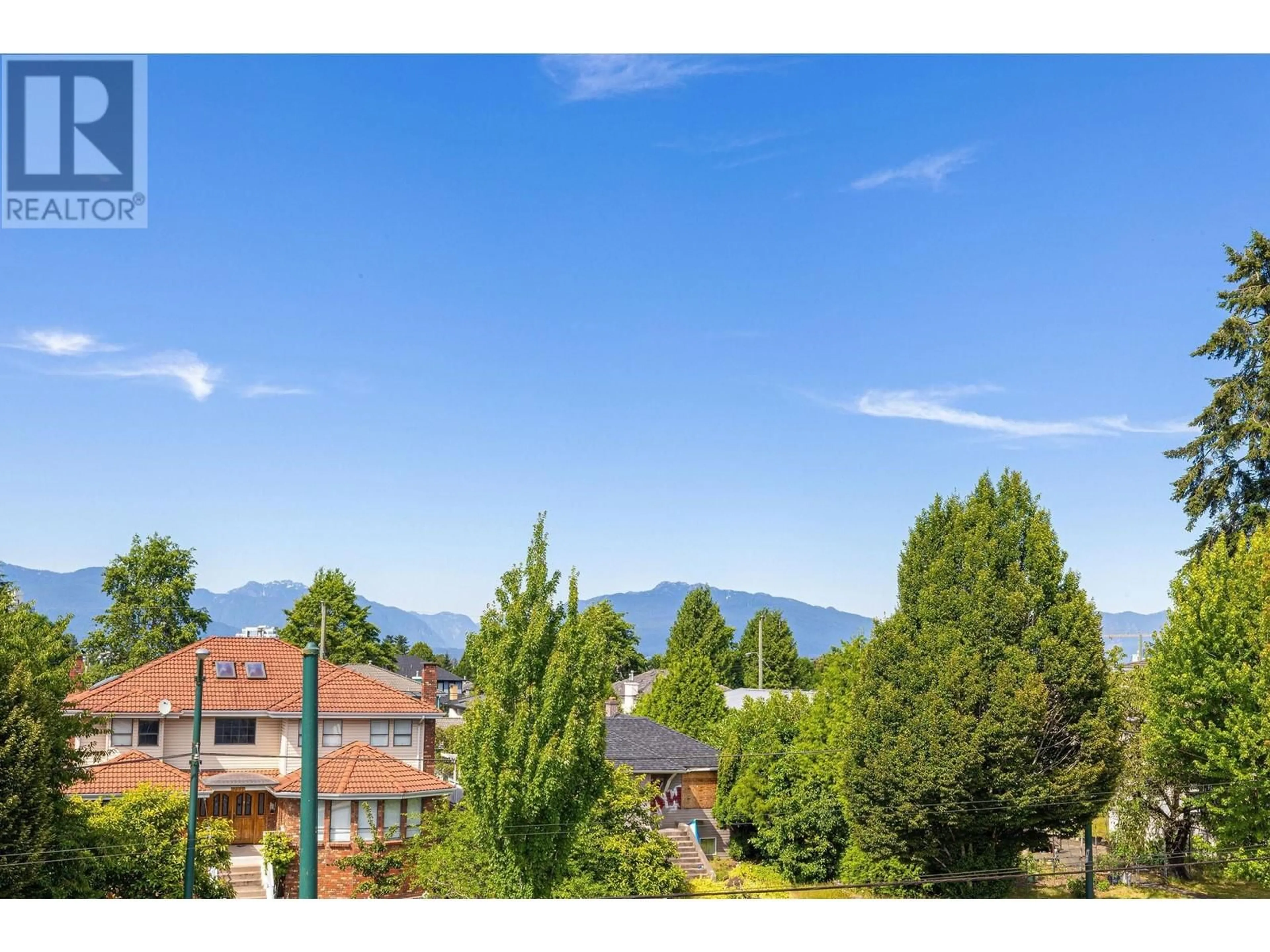 A pic from outside/outdoor area/front of a property/back of a property/a pic from drone, mountain view for 1 2430 E 41 STREET, Vancouver British Columbia V5R2W4