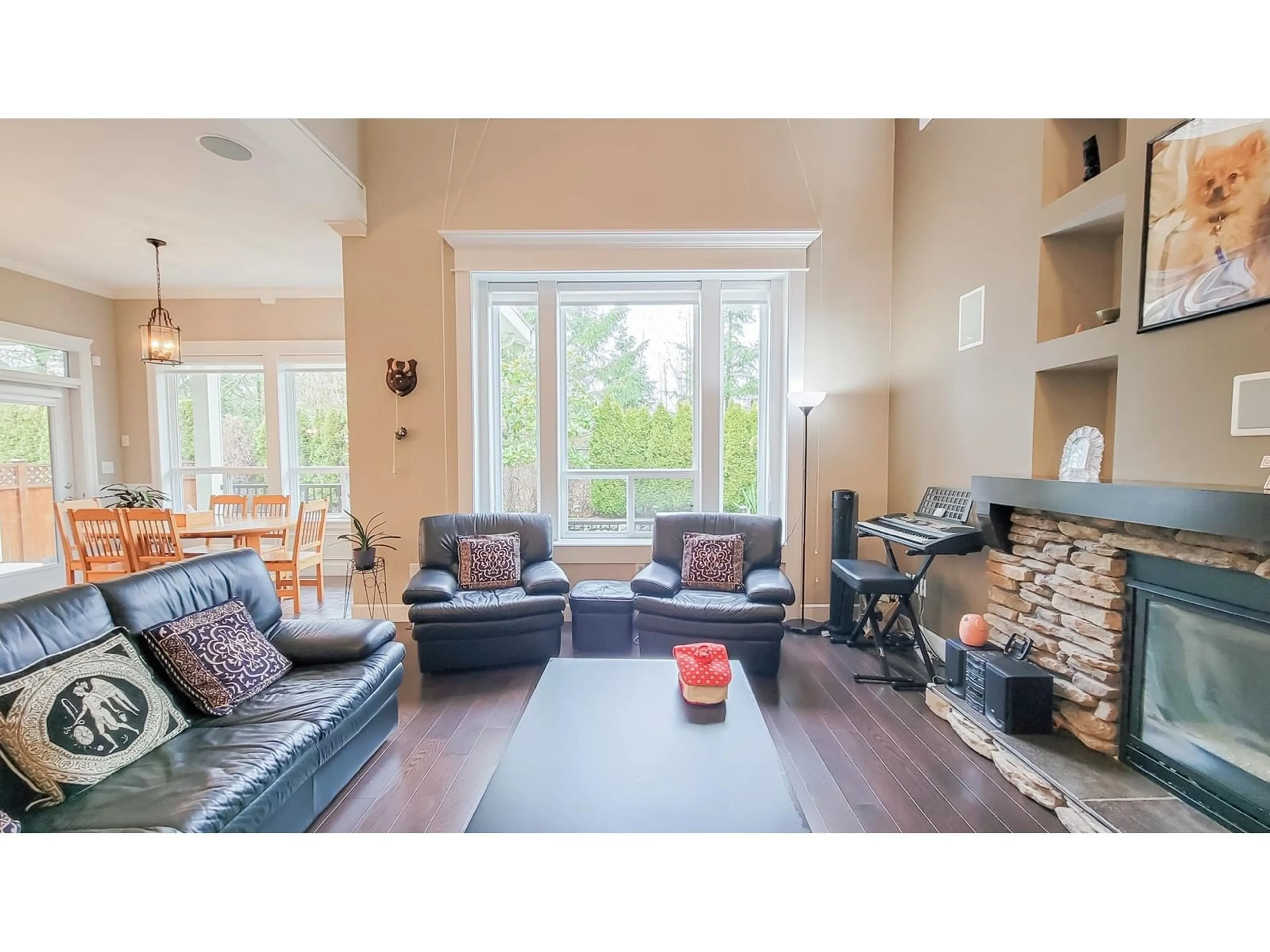 Living room with furniture, wood/laminate floor for 8101 211B STREET, Langley British Columbia V2Y0E8