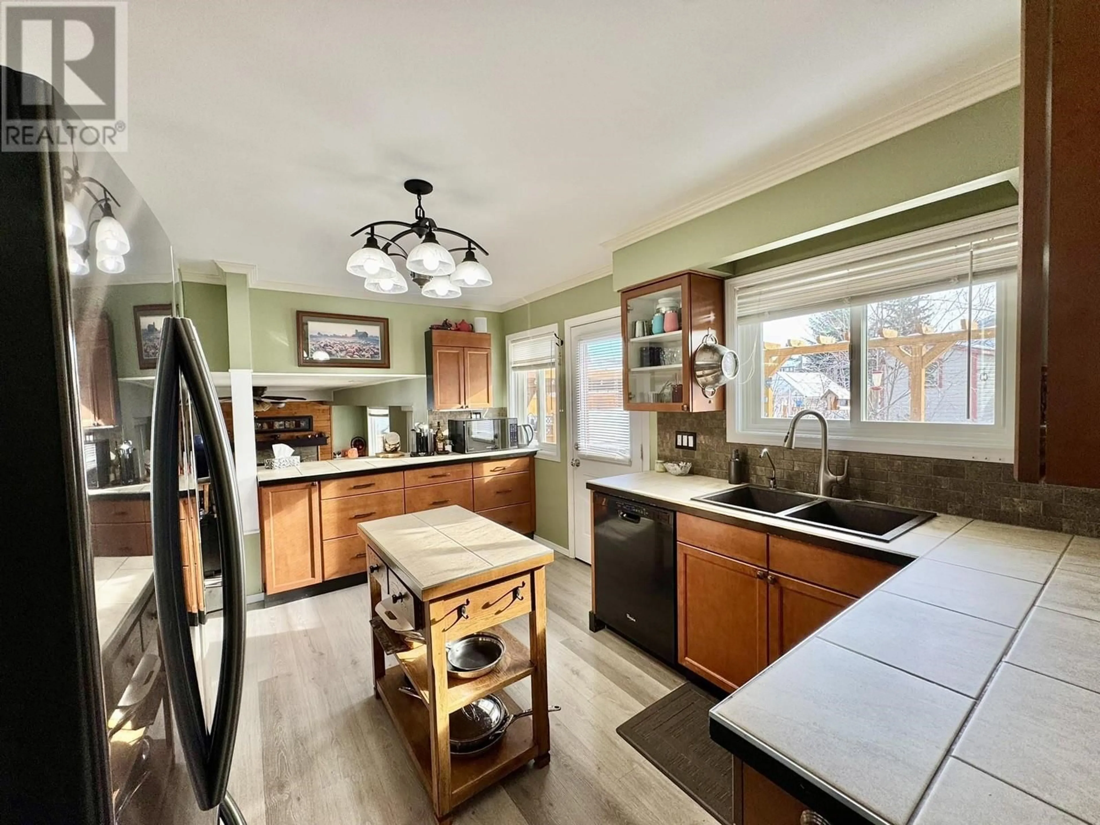 Open concept kitchen, ceramic/tile floor for 253 N BIRCH AVENUE, 100 Mile House British Columbia V0K2E0