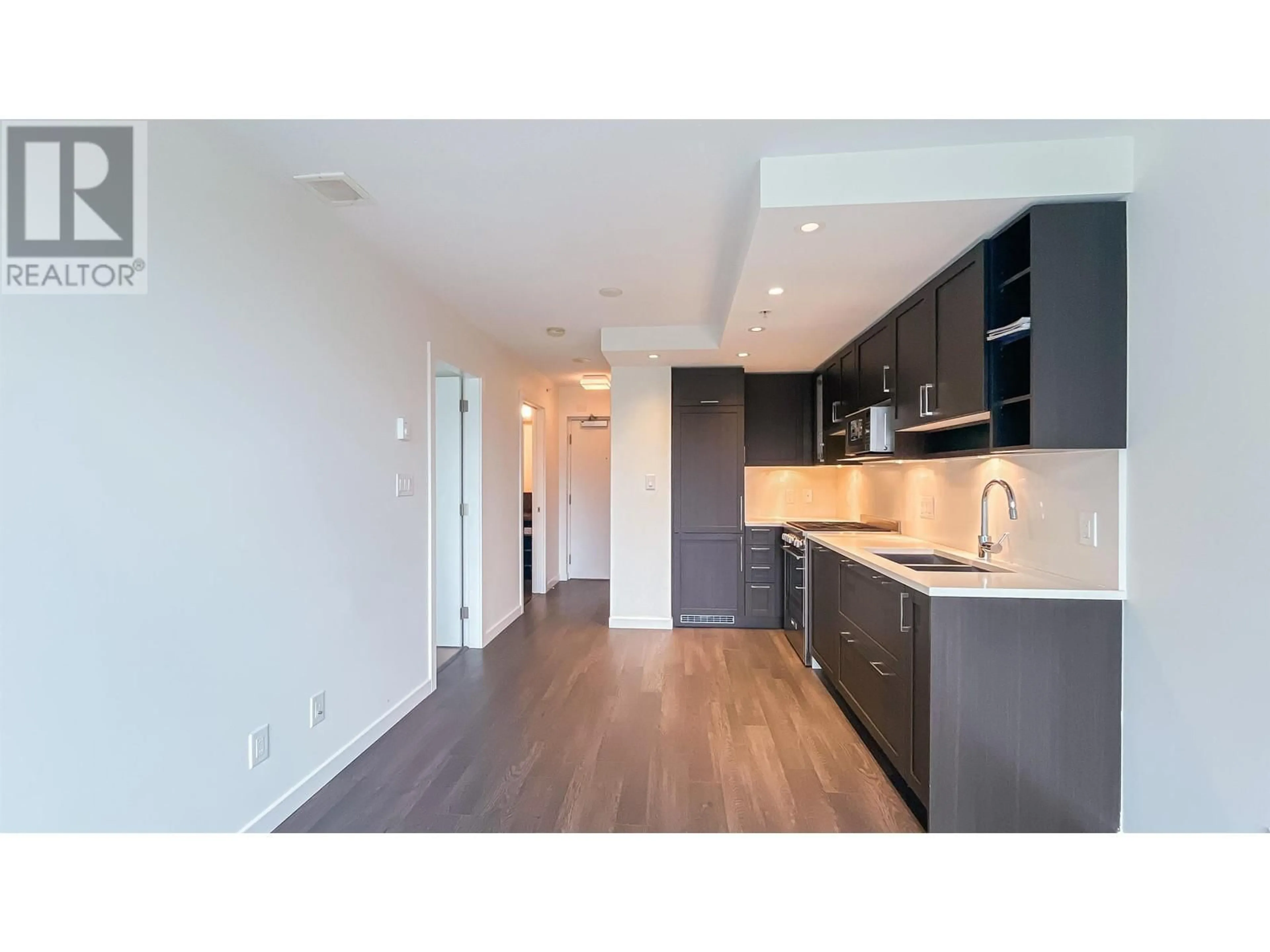 Open concept kitchen, wood/laminate floor for 306 5515 BOUNDARY ROAD, Vancouver British Columbia V5R0E3