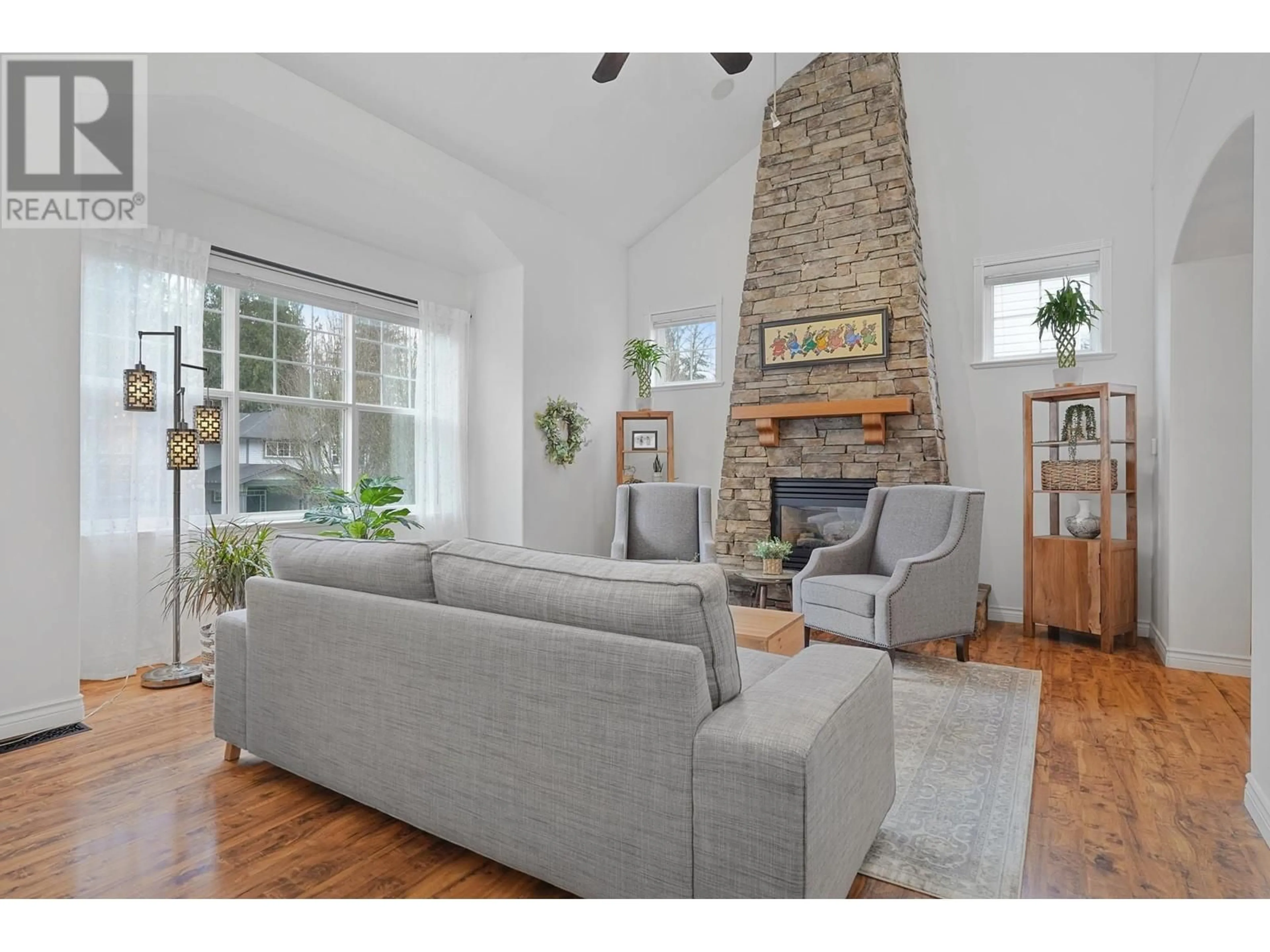 Living room with furniture, wood/laminate floor for 23349 133 AVENUE, Maple Ridge British Columbia V4R2W6