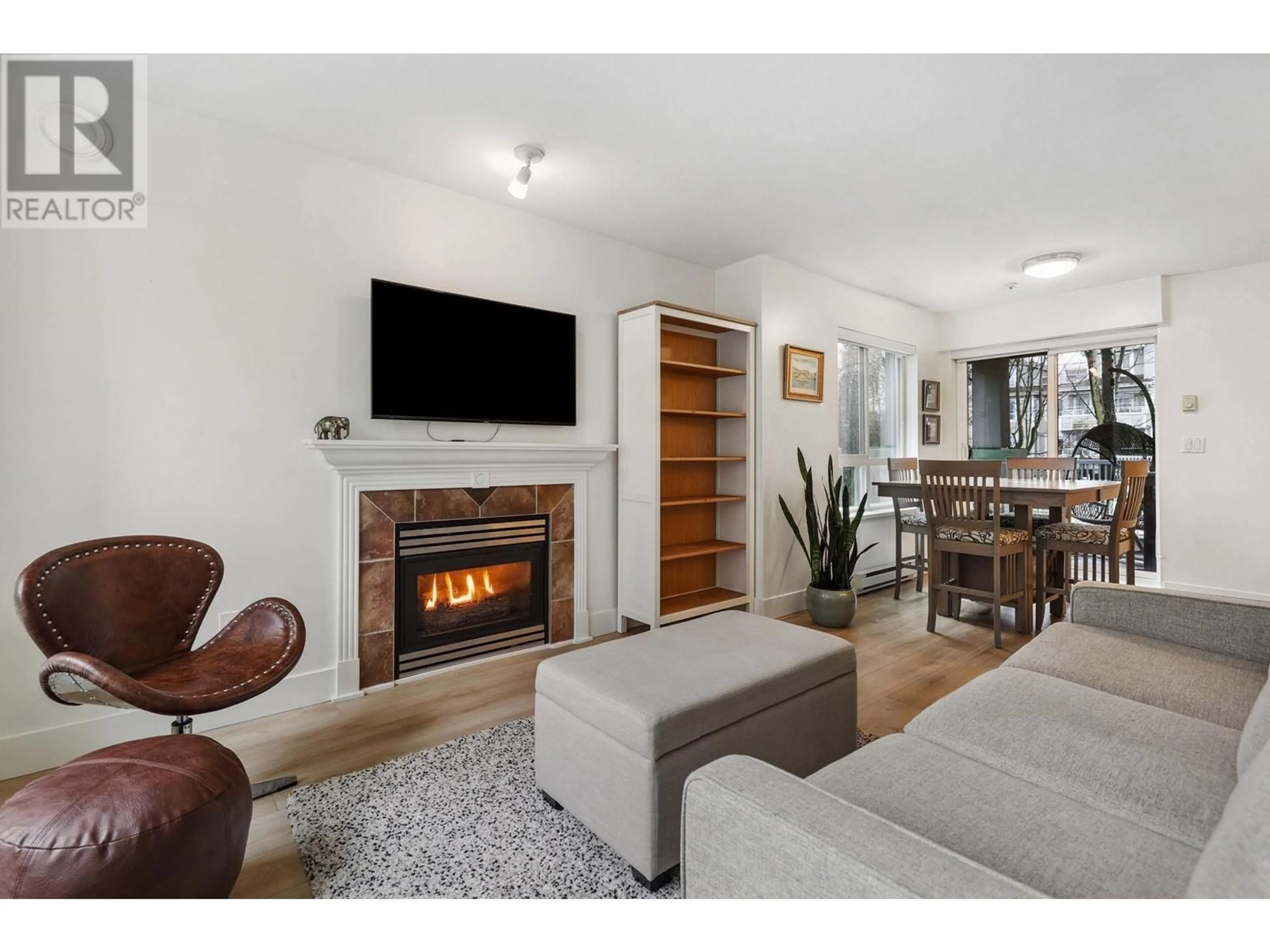 Living room with furniture, wood/laminate floor for 209 3235 W 4TH AVENUE, Vancouver British Columbia V6K1R8