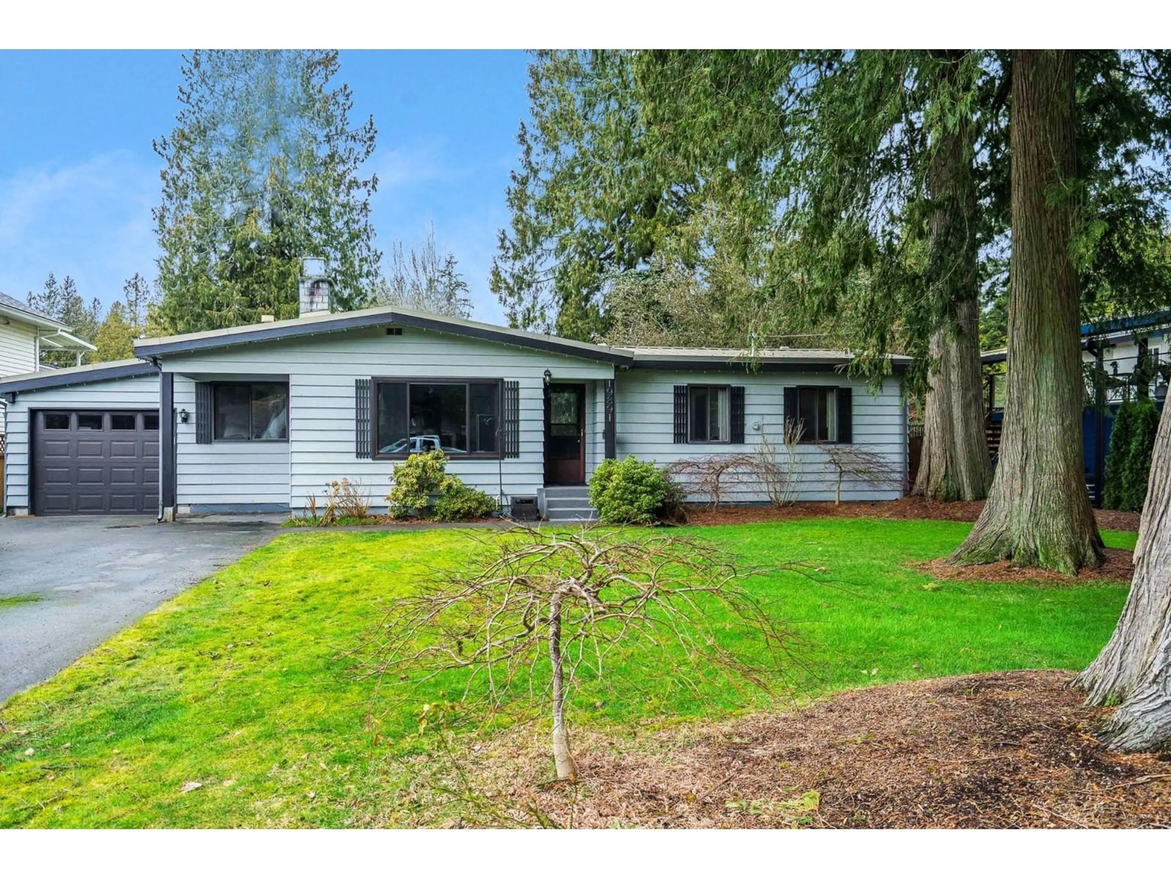 Home with vinyl exterior material, street for 19891 43A AVENUE, Langley British Columbia V3A3C3