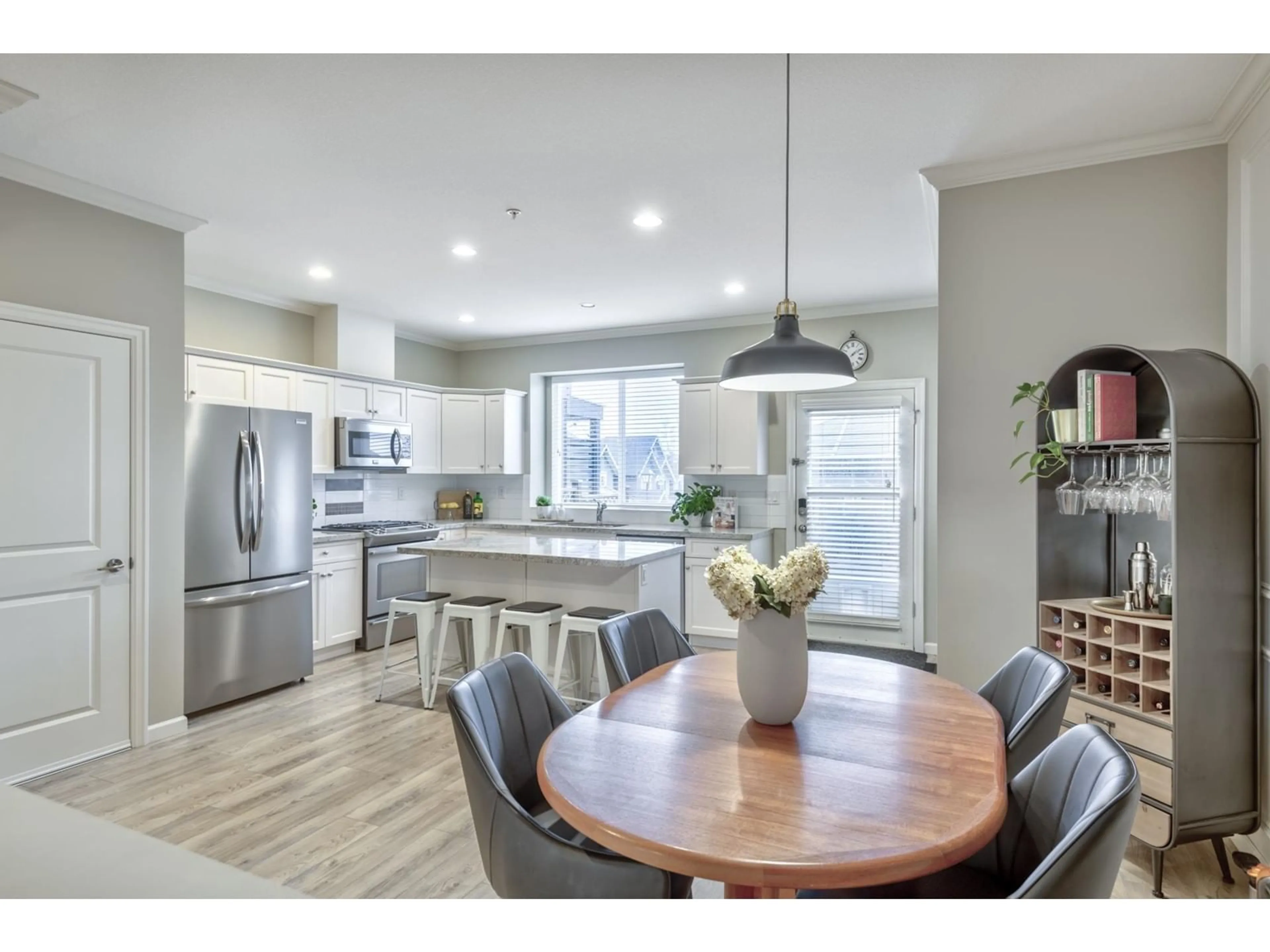 Open concept kitchen, wood/laminate floor for 20894 72 AVENUE, Langley British Columbia V2Y0J1