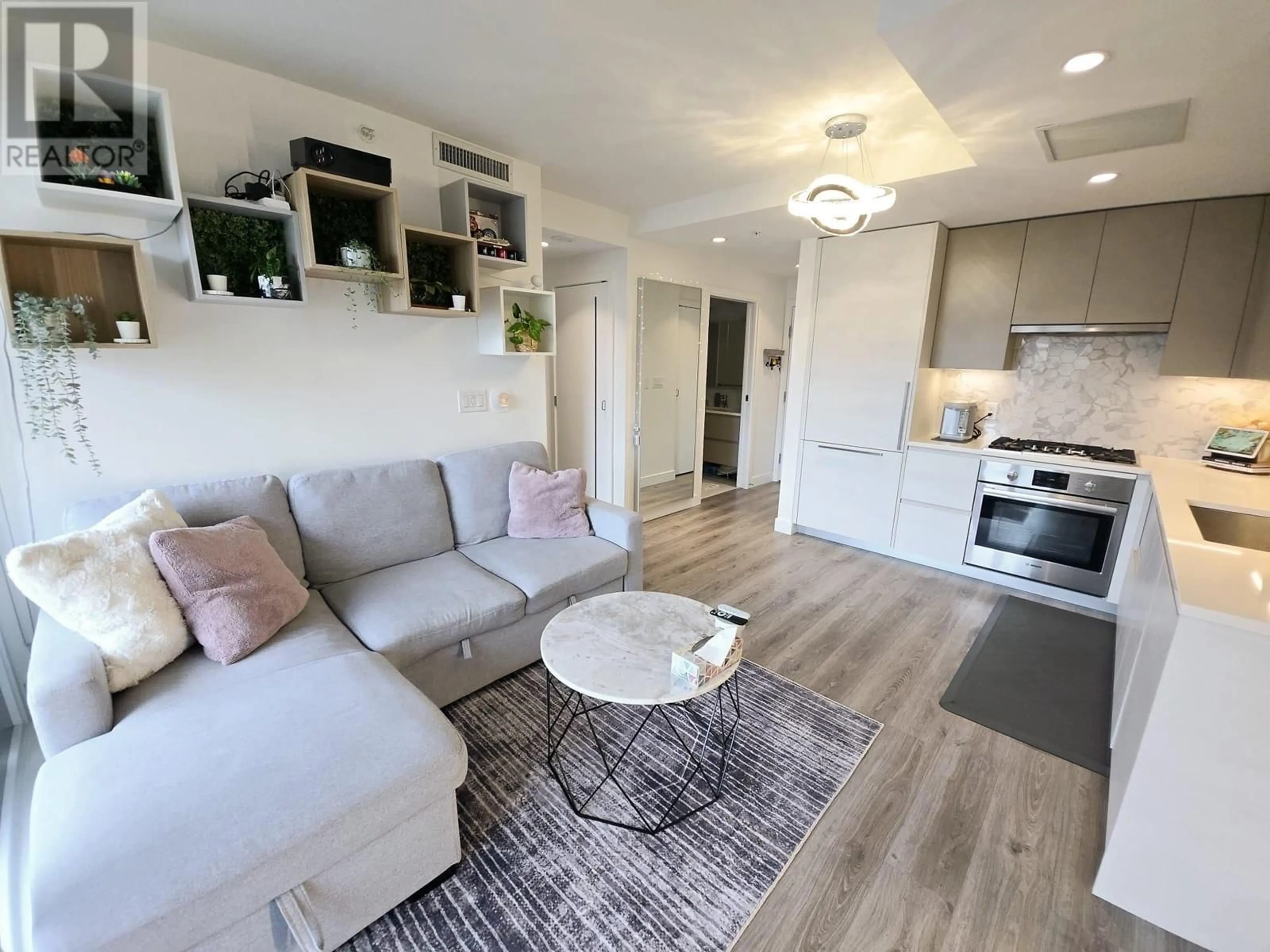 Living room with furniture, unknown for 214 - 8181 CHESTER STREET, Vancouver British Columbia V5X0J9