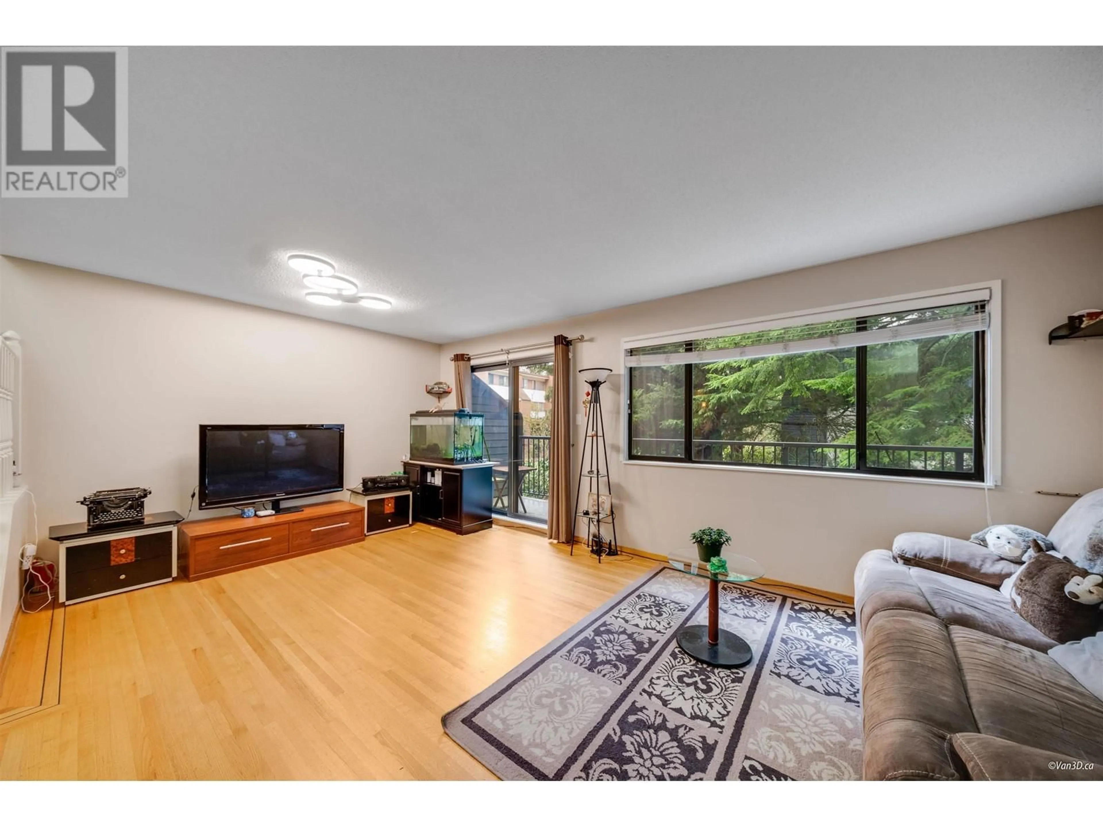 Living room with furniture, wood/laminate floor for 7305 CORONADO DRIVE, Burnaby British Columbia V5A1P9