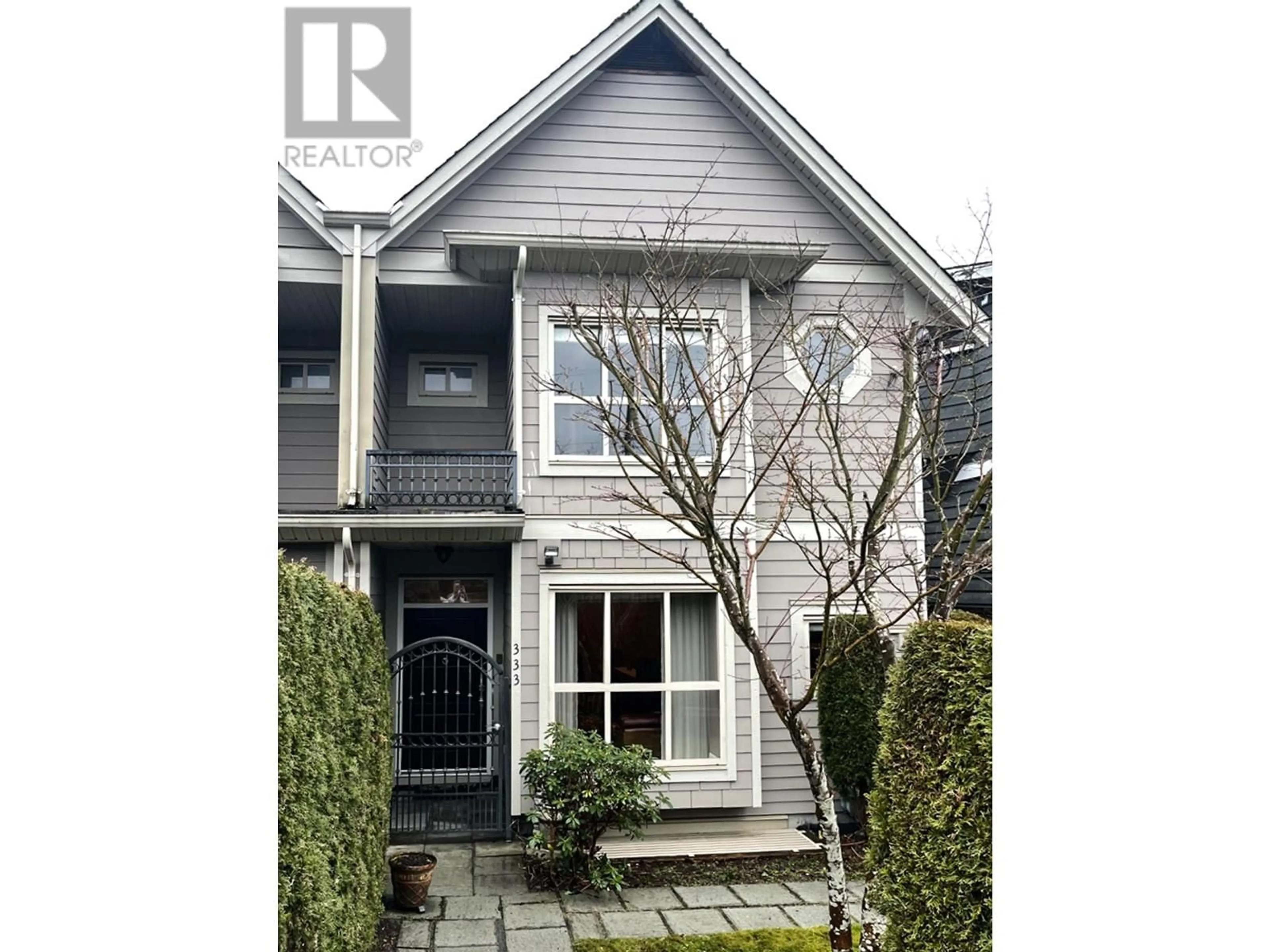 Home with vinyl exterior material, street for 333 E 11TH STREET, North Vancouver British Columbia V7L2H1