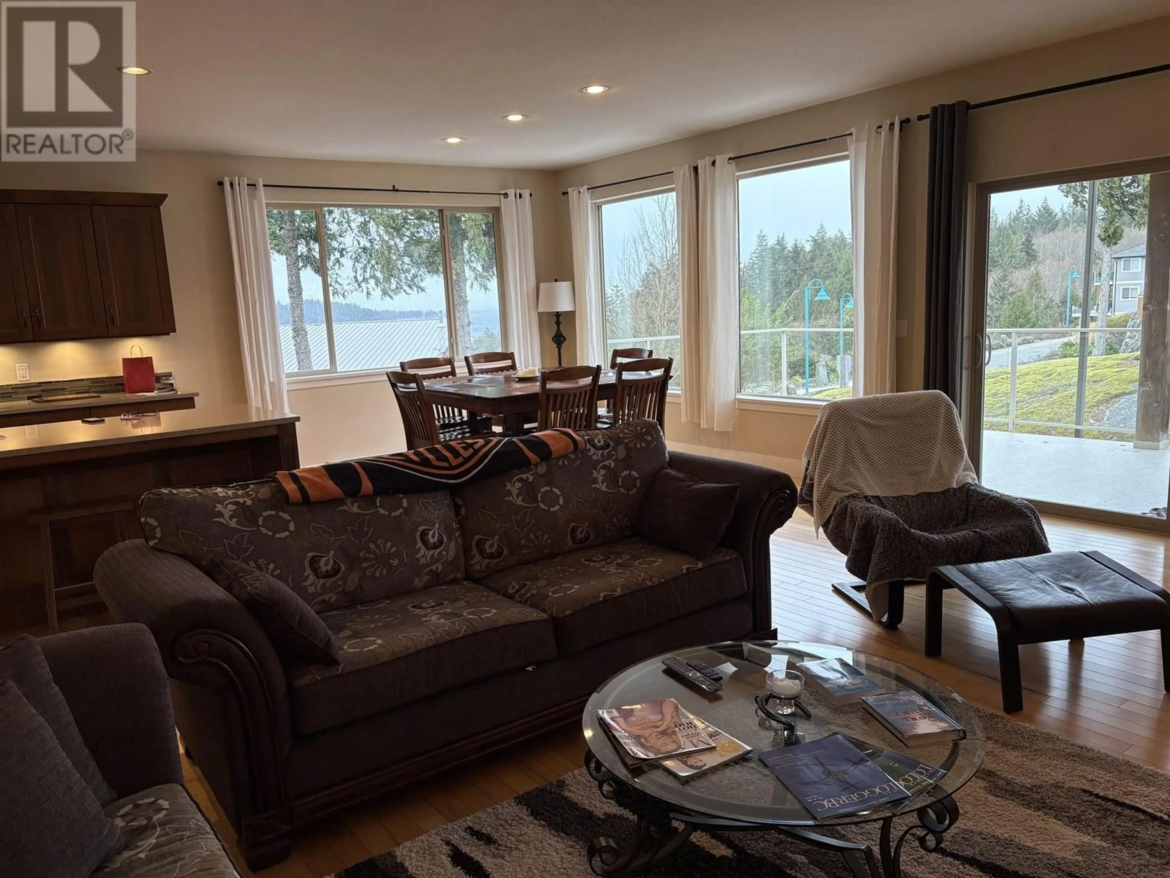 Living room with furniture, wood/laminate floor for 5781 GENNI'S WAY, Sechelt British Columbia V7Z0N8