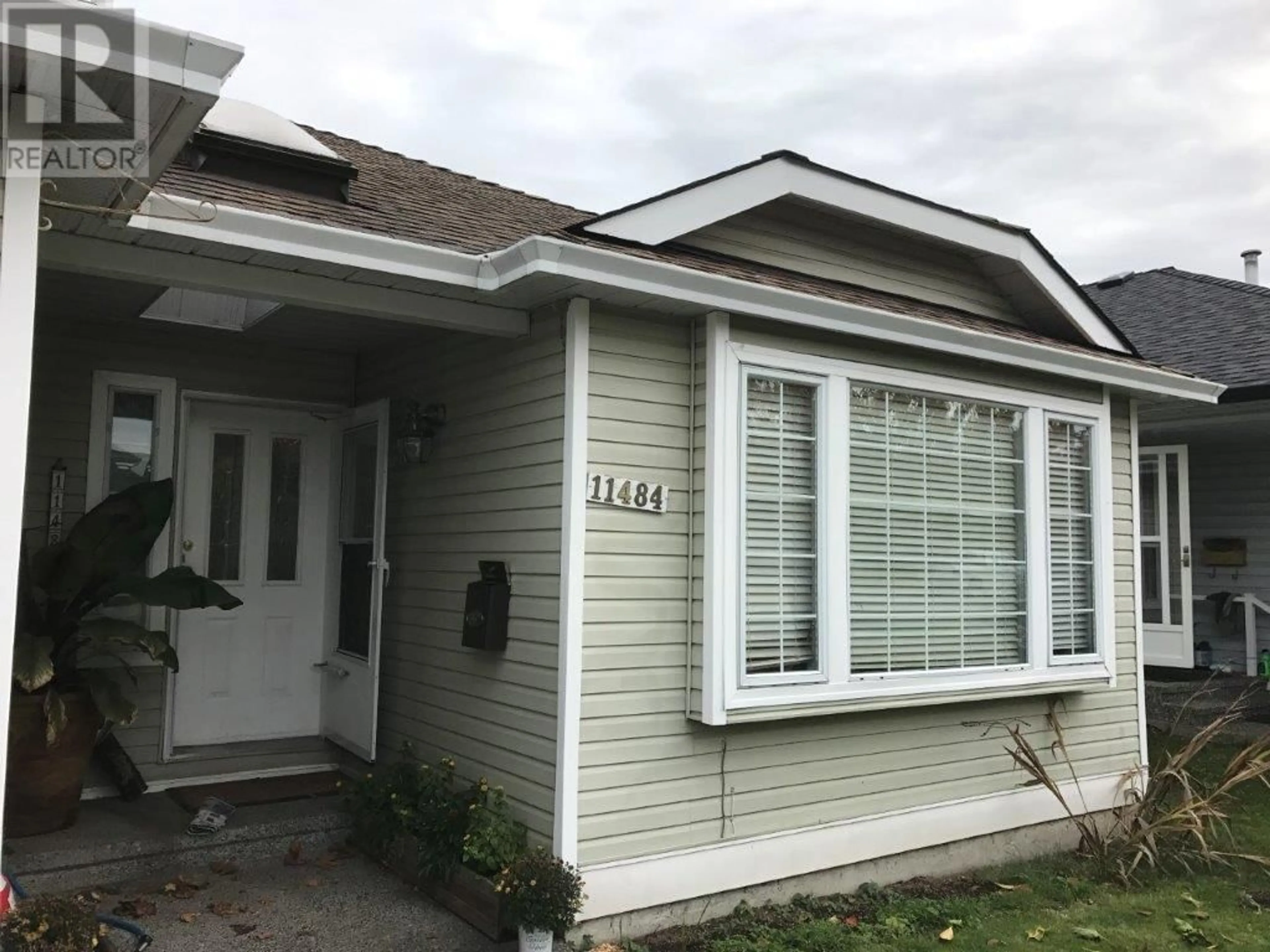 Home with vinyl exterior material, street for 11484 207 STREET, Maple Ridge British Columbia V2X1X1