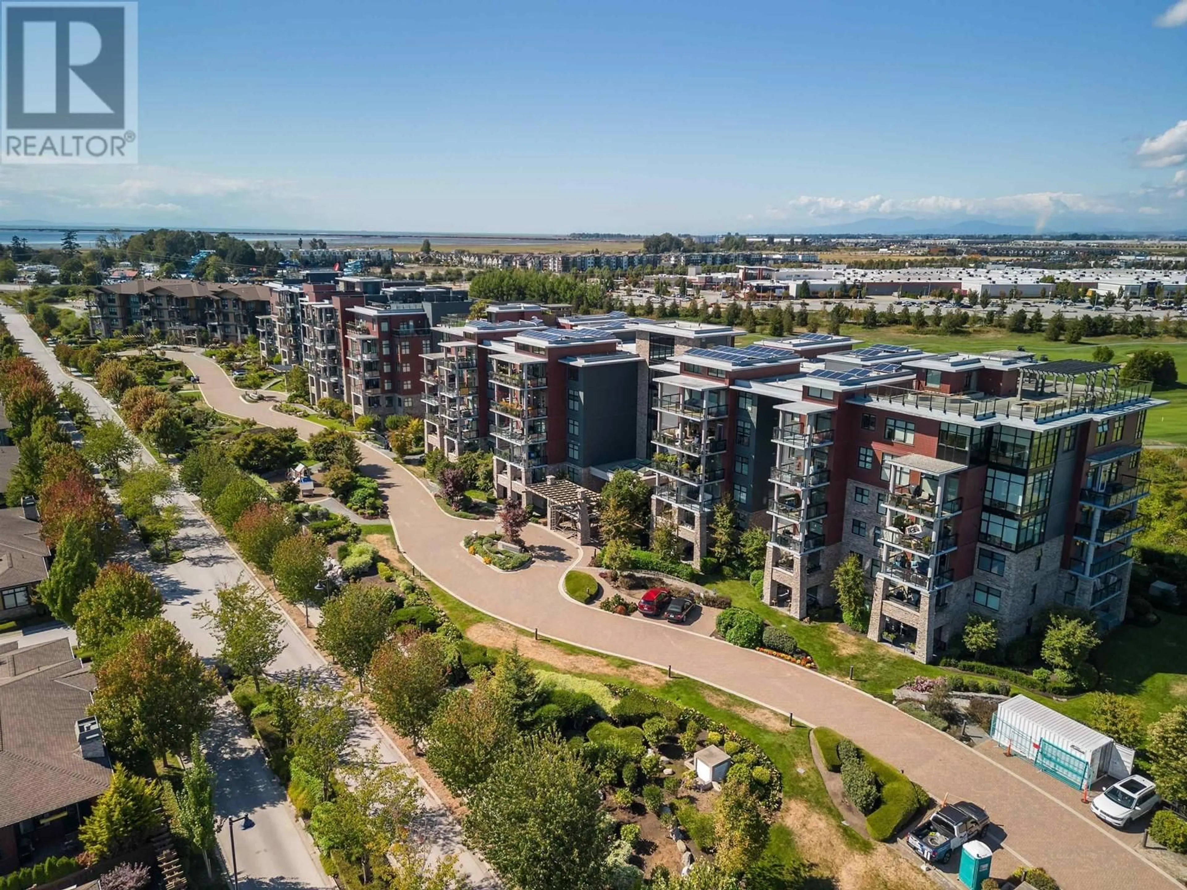 A pic from outside/outdoor area/front of a property/back of a property/a pic from drone, city buildings view from balcony for 406 5055 SPRINGS BOULEVARD, Delta British Columbia V4M0A5