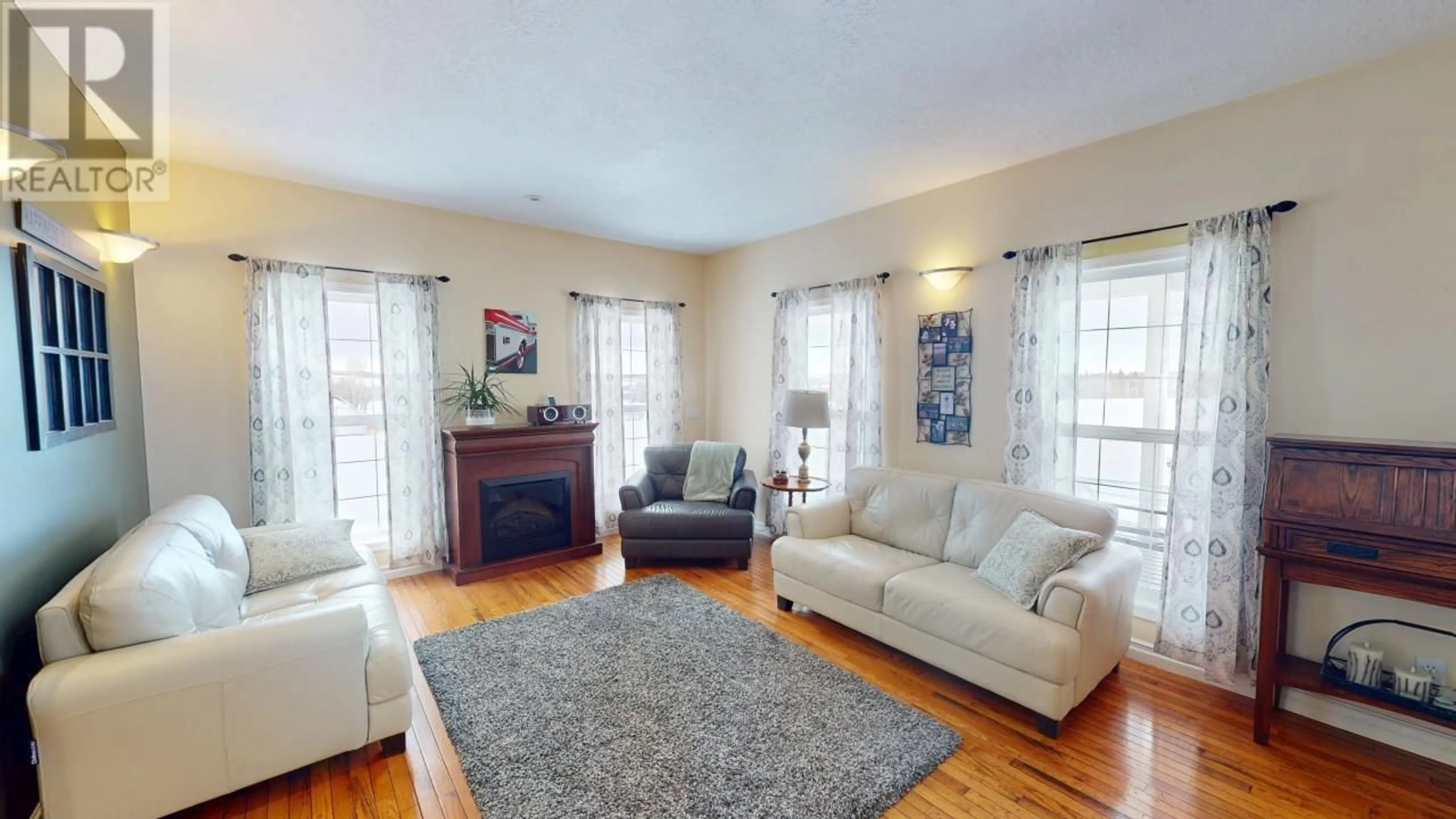 Living room with furniture, wood/laminate floor for 20110 GARCIA STREET, Fort St. John British Columbia V0C2R0