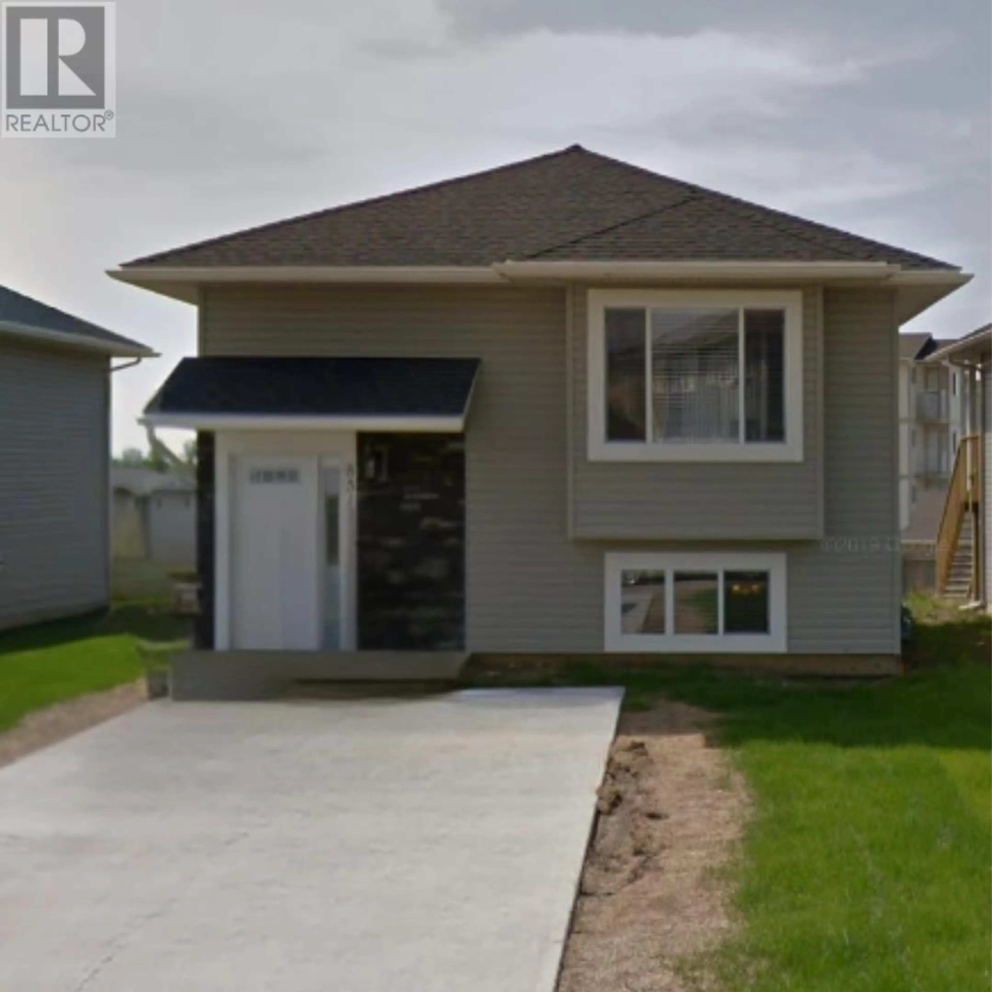 Home with vinyl exterior material, street for 8512 85 STREET, Fort St. John British Columbia V1J0G5