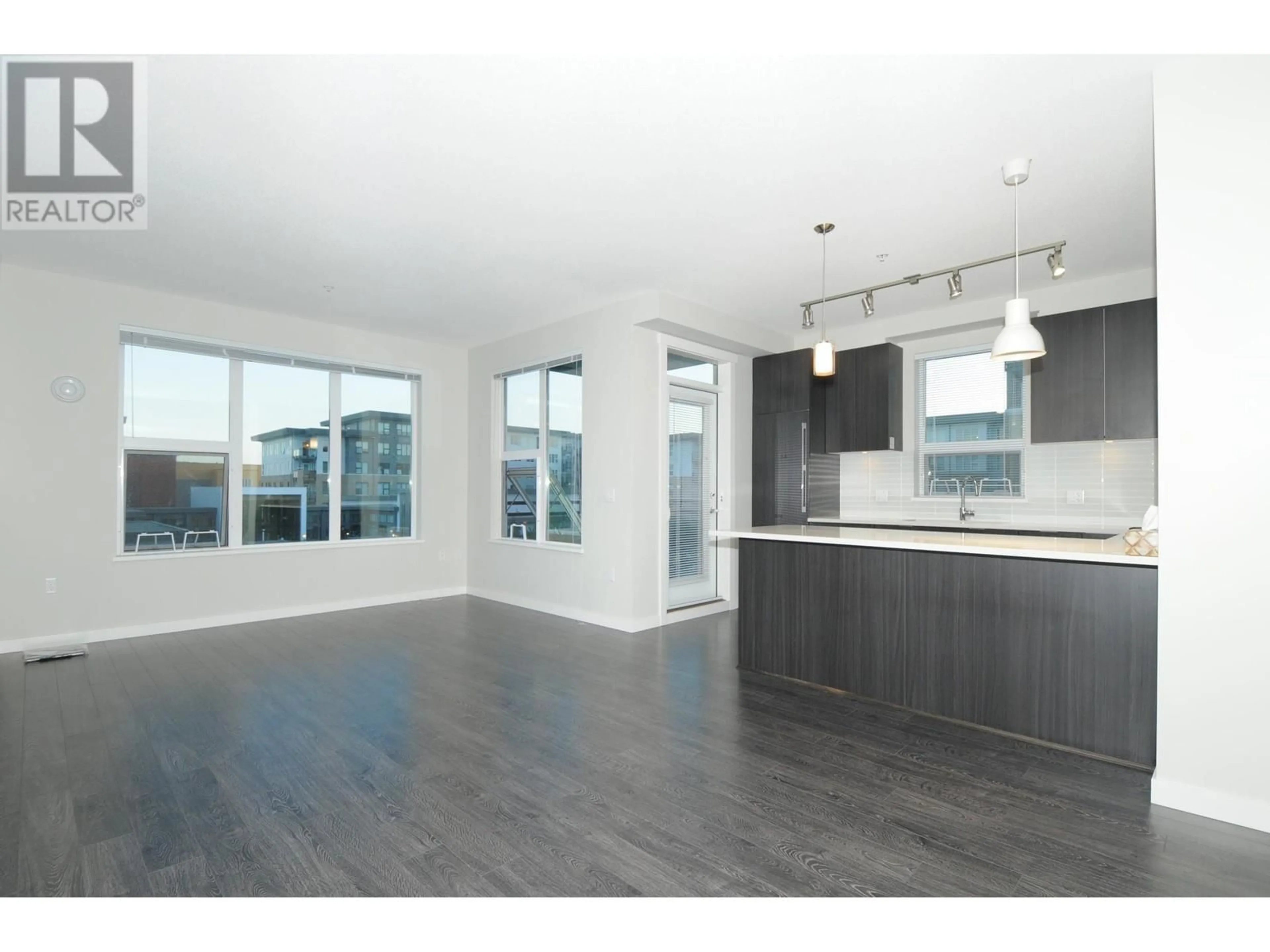 Open concept kitchen, wood/laminate floor for 305 - 9388 TOMICKI AVENUE, Richmond British Columbia V6X0P1