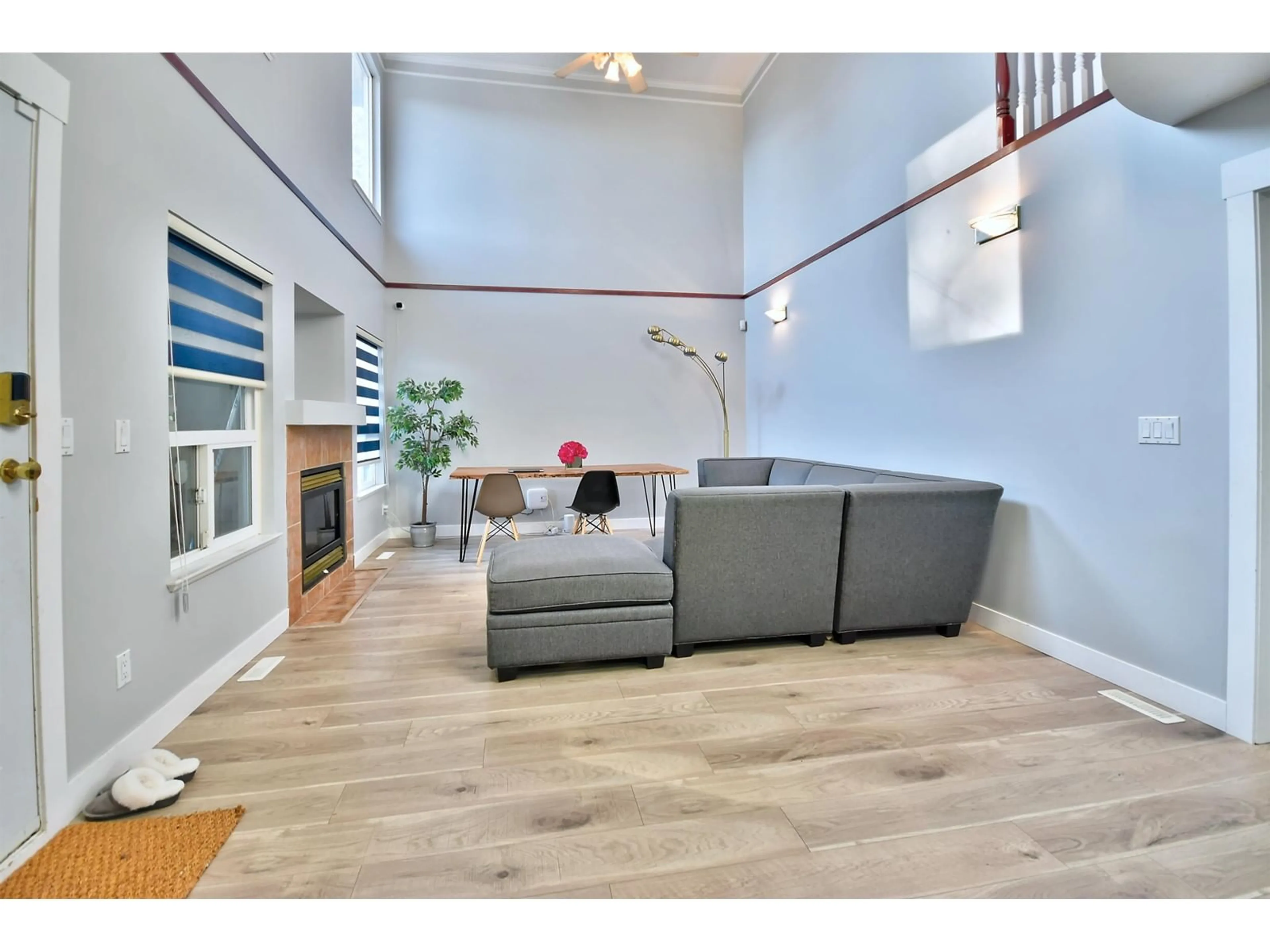 Living room with furniture, wood/laminate floor for 15402 110 AVENUE, Surrey British Columbia V3R0X1