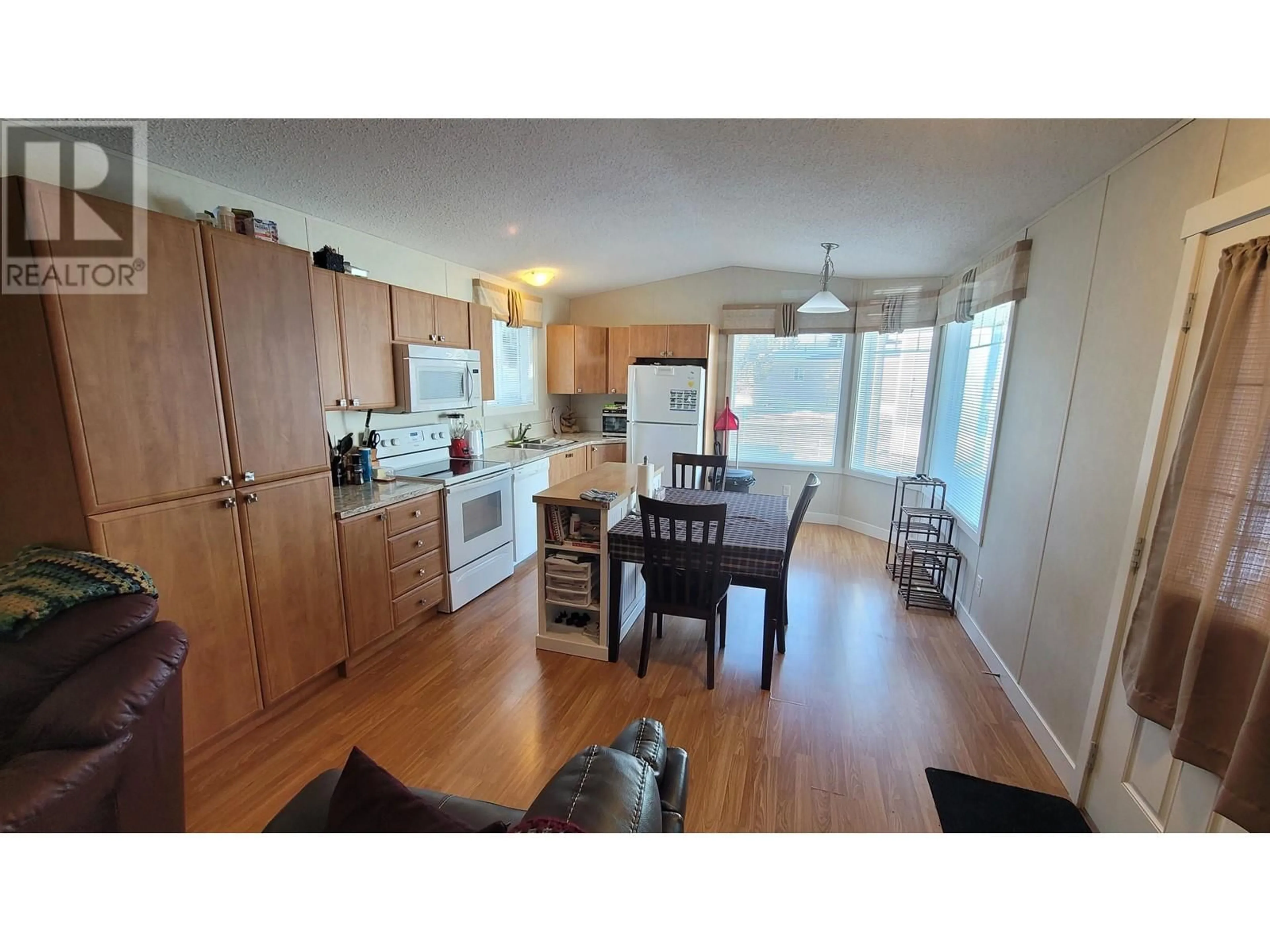 Open concept kitchen, wood/laminate floor for 101 - 3616 LARCH AVENUE, Terrace British Columbia V8G5B9
