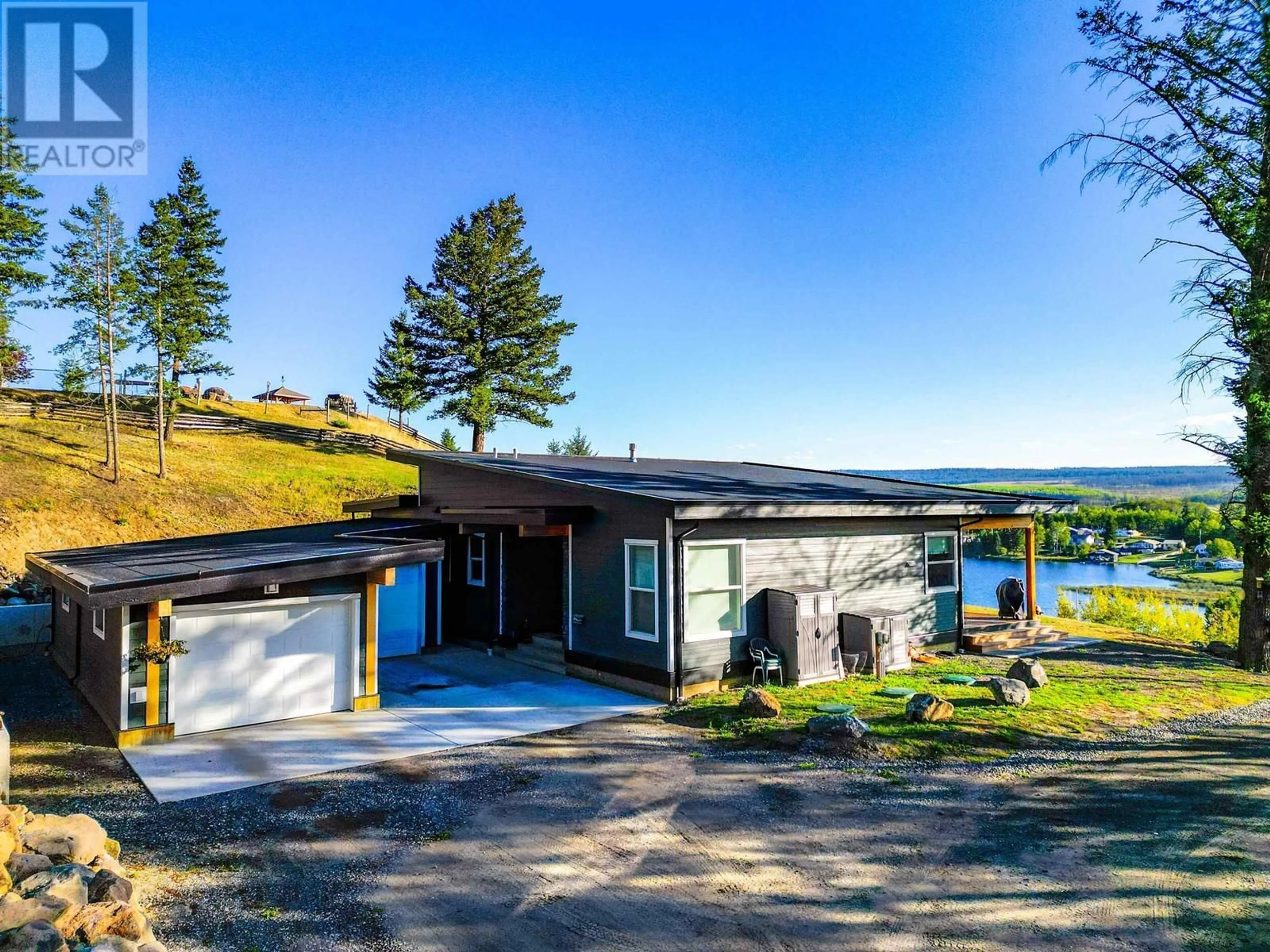 A pic from outside/outdoor area/front of a property/back of a property/a pic from drone, water/lake/river/ocean view for 5046 BLOCK DRIVE, 108 Mile Ranch British Columbia V0K2Z0