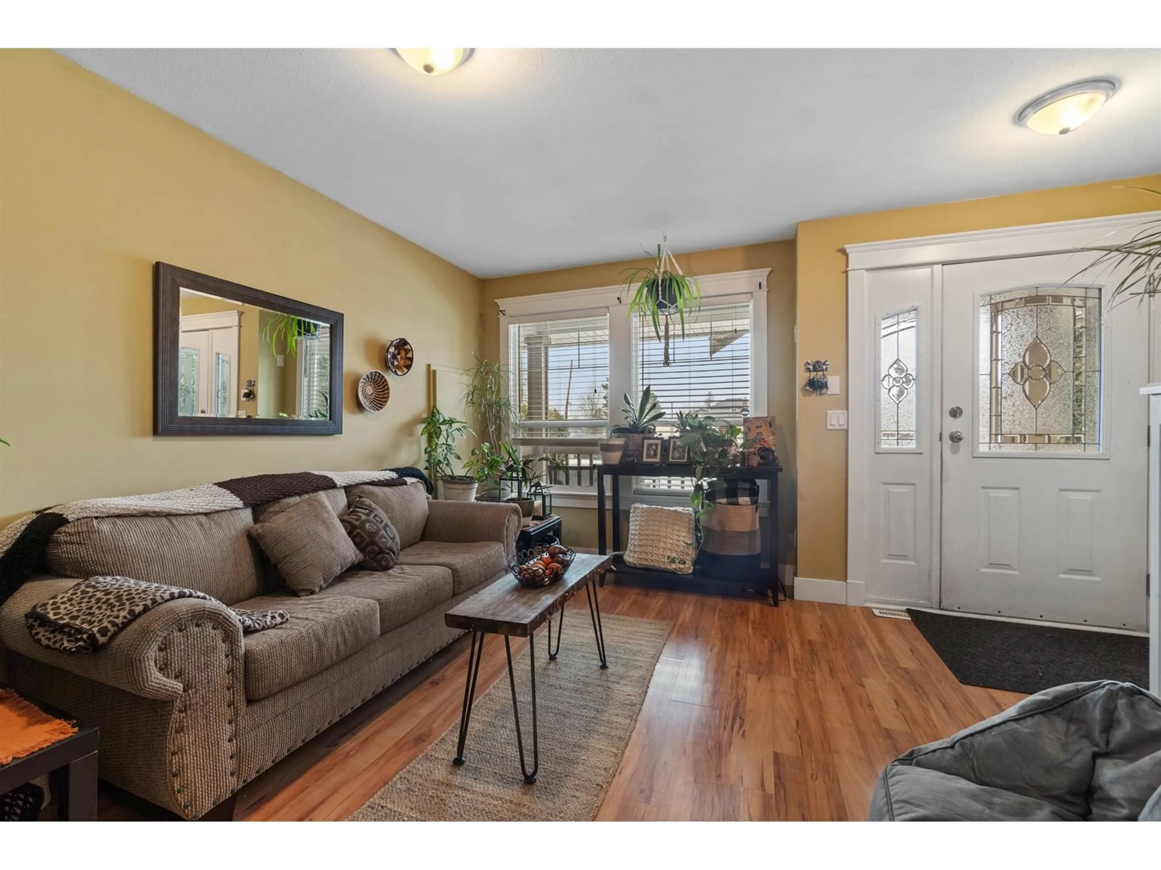 Living room with furniture, wood/laminate floor for 7588 STAVE LAKE STREET, Mission British Columbia V2V4G3