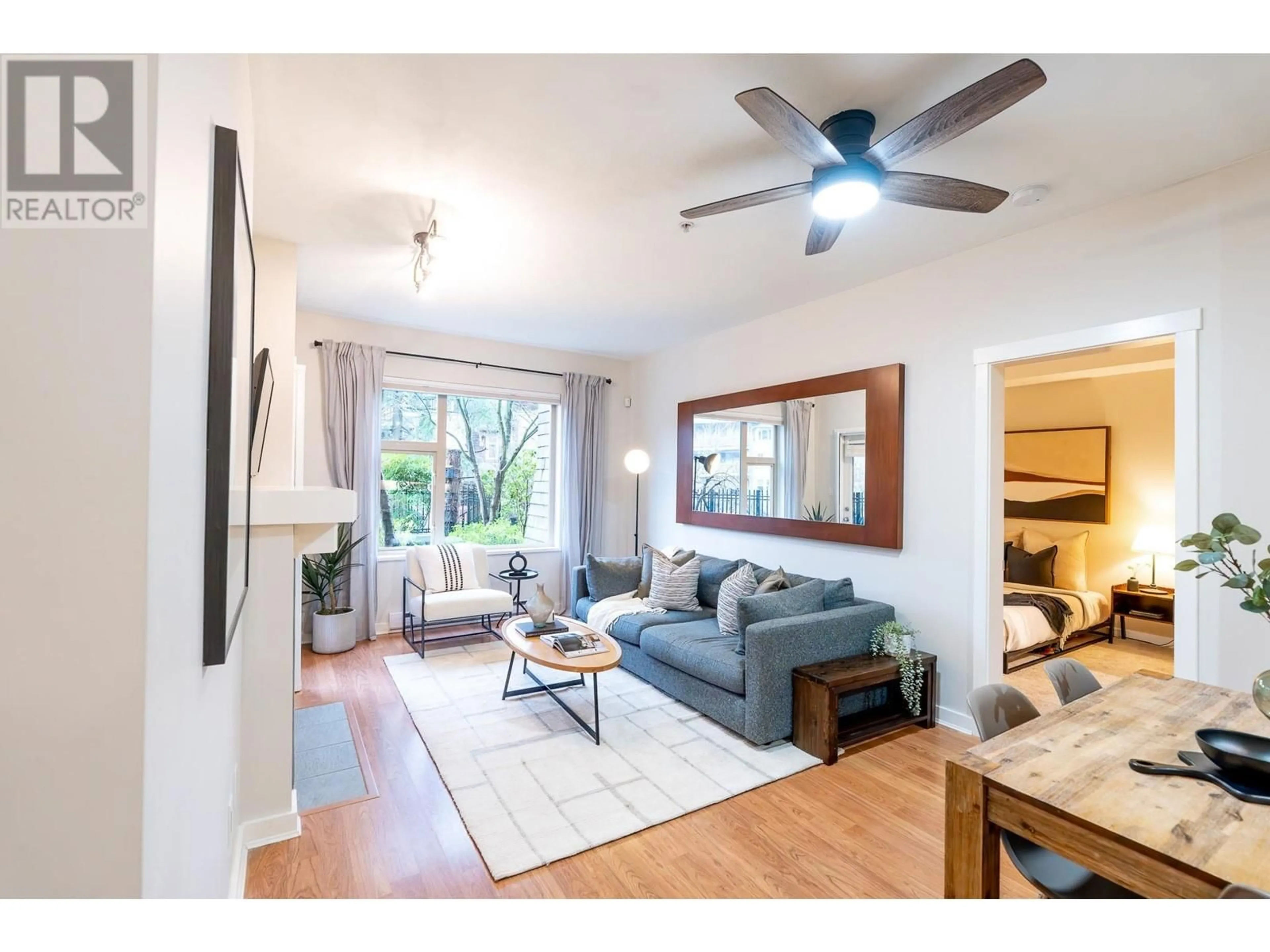 Living room with furniture, wood/laminate floor for 103 625 PARK CRESCENT, New Westminster British Columbia V3L5W4