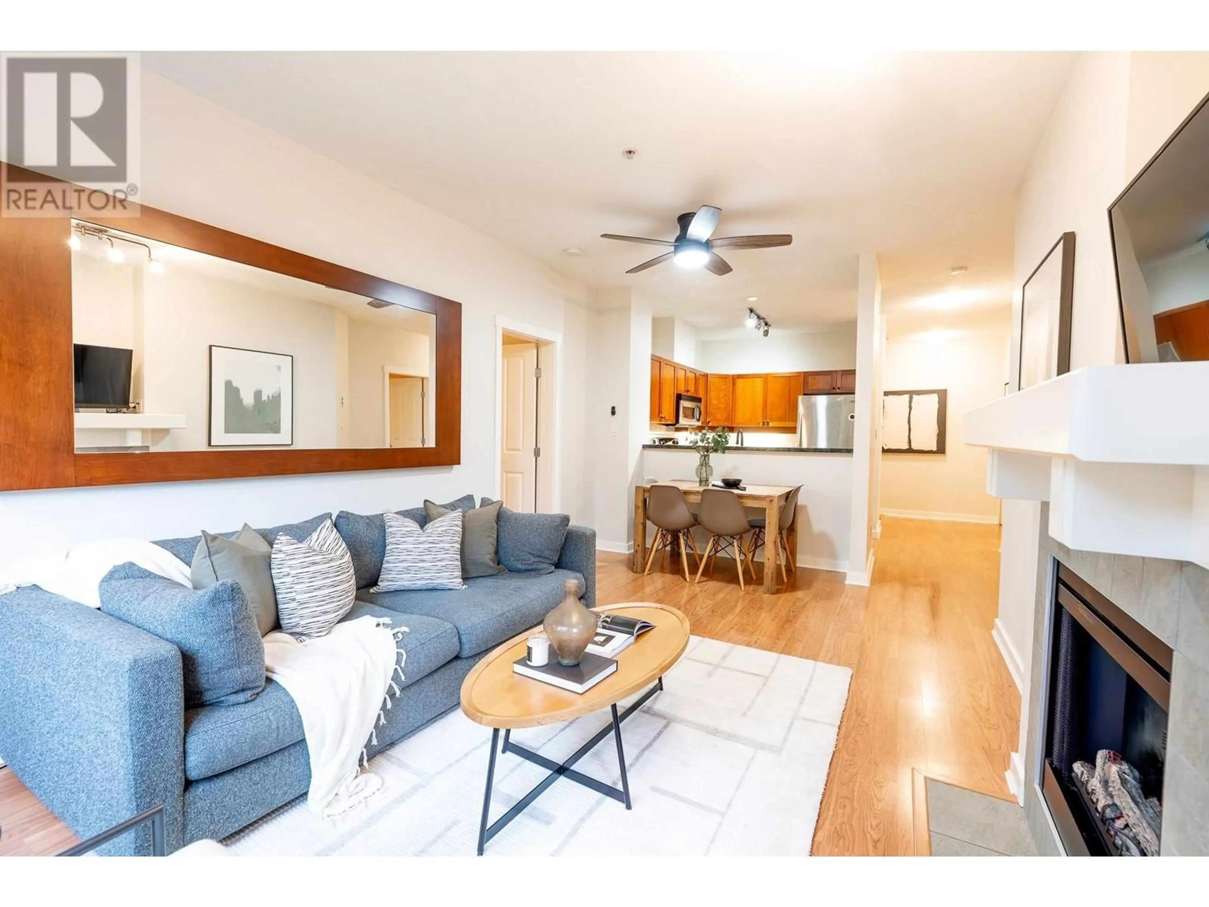 Living room with furniture, wood/laminate floor for 103 625 PARK CRESCENT, New Westminster British Columbia V3L5W4