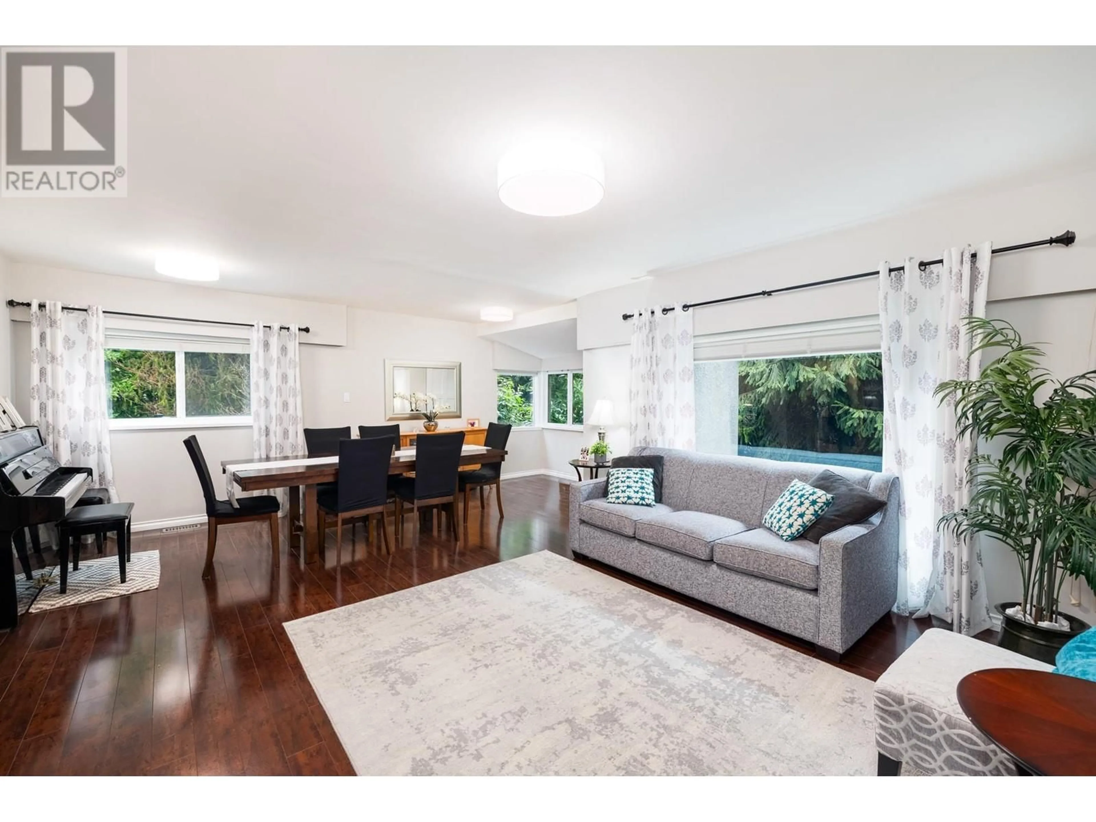 Living room with furniture, wood/laminate floor for 4233 CAPILANO ROAD, North Vancouver British Columbia V7R4J6