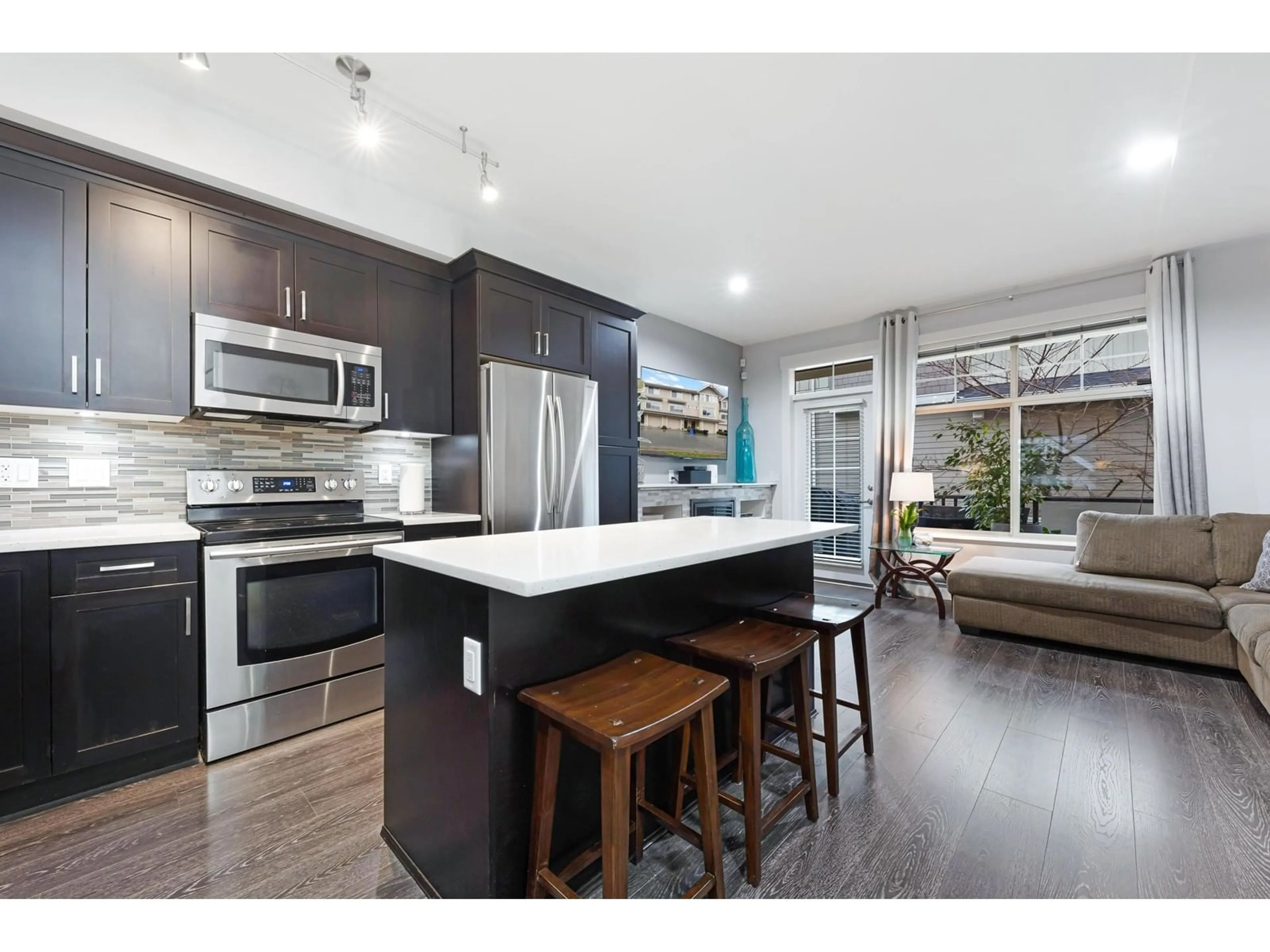 Open concept kitchen, wood/laminate floor for 63 19525 73 AVENUE, Surrey British Columbia V4N6L7