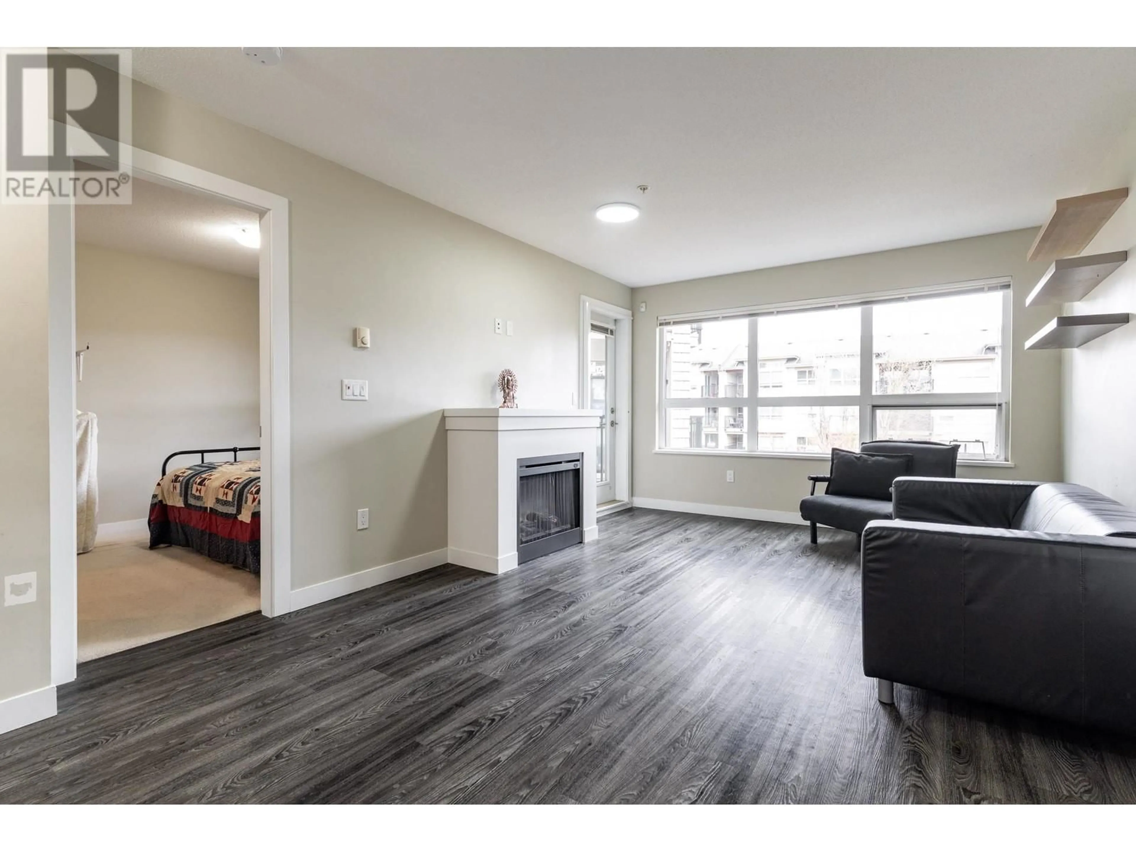 Living room with furniture, wood/laminate floor for 310 6828 ECKERSLEY ROAD, Richmond British Columbia V6Y0E8