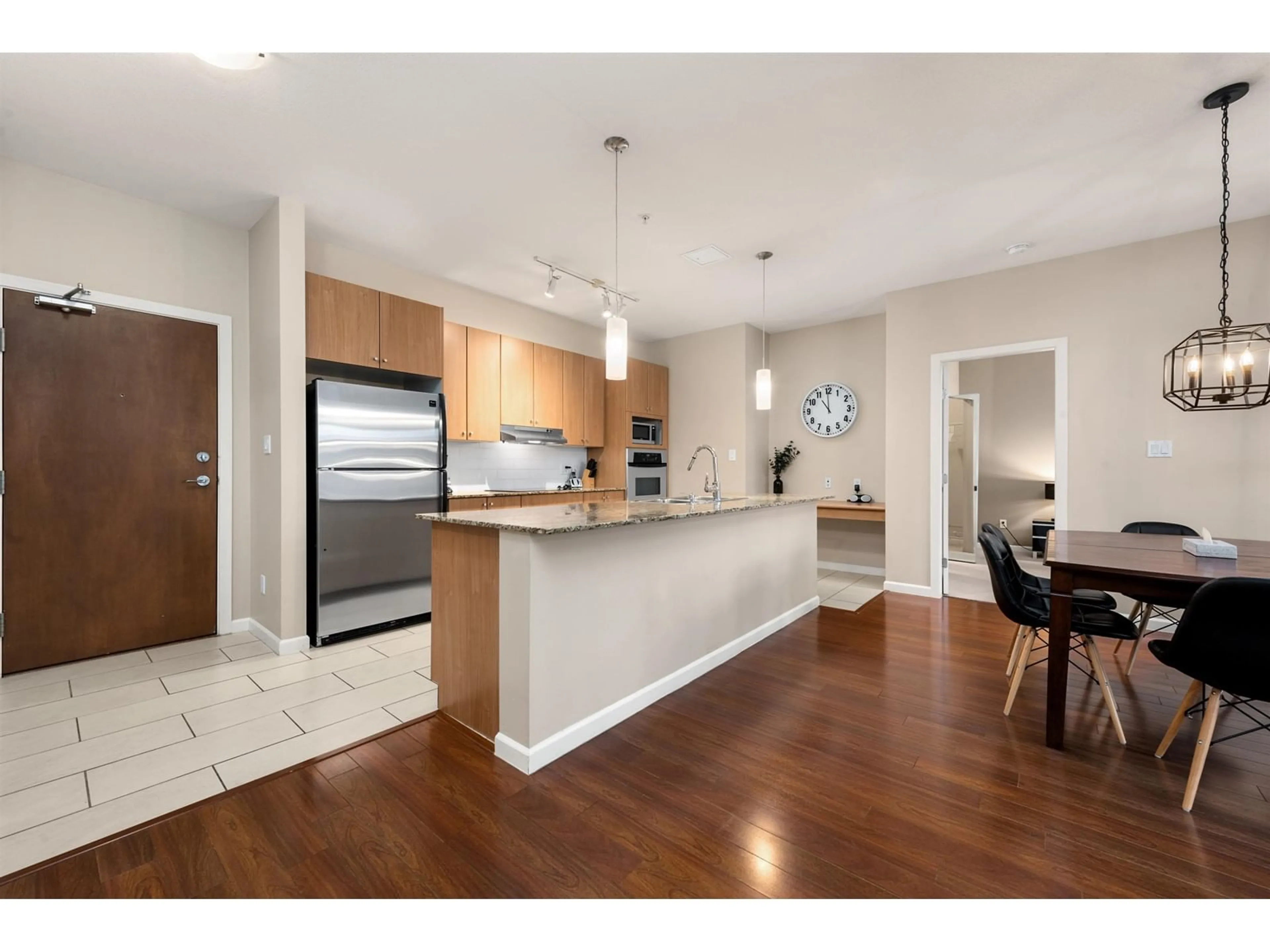 Open concept kitchen, wood/laminate floor for 313 15322 101 AVENUE, Surrey British Columbia V3R4G9