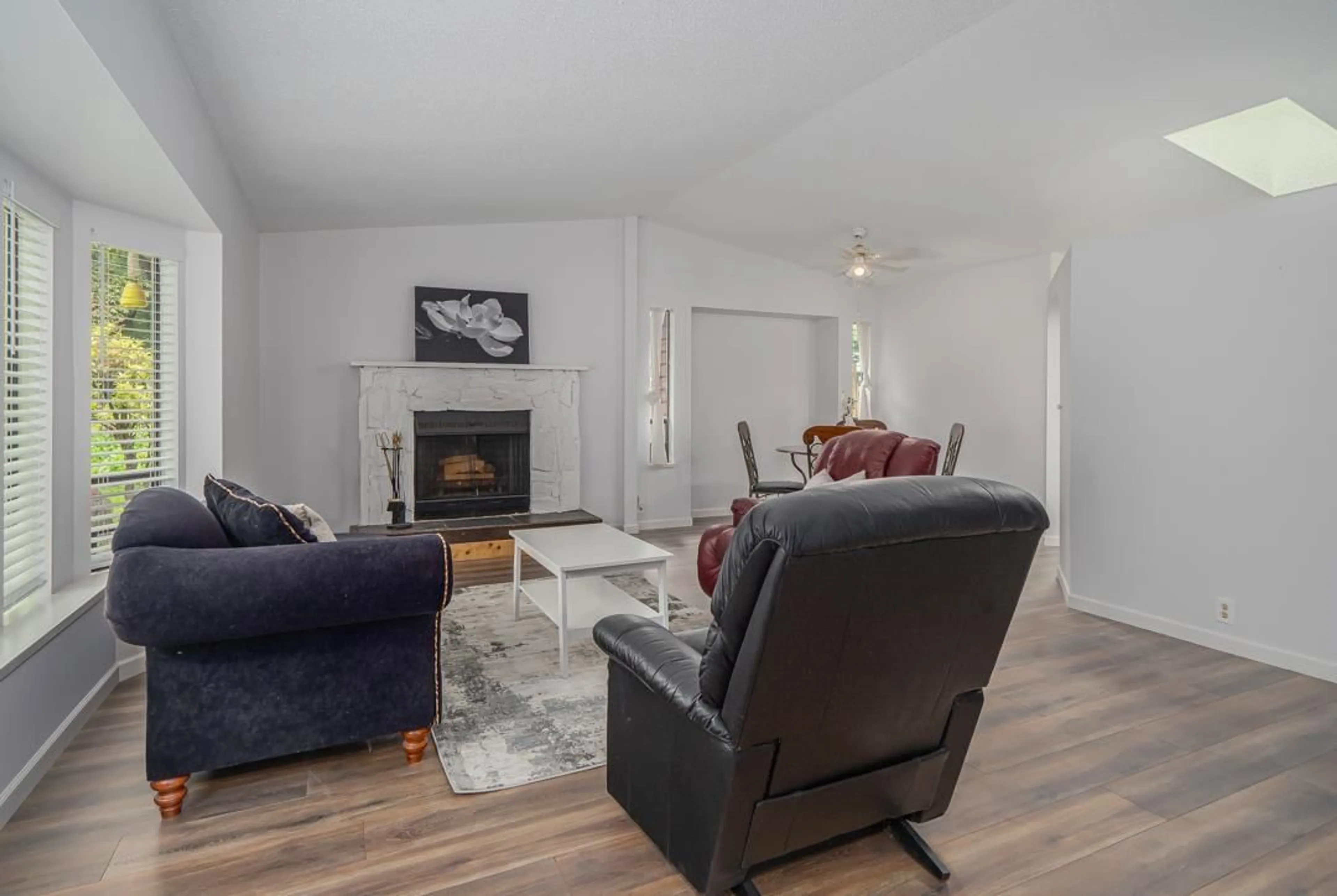 Living room with furniture, wood/laminate floor for 14522 92 AVENUE, Surrey British Columbia V2Z2L4