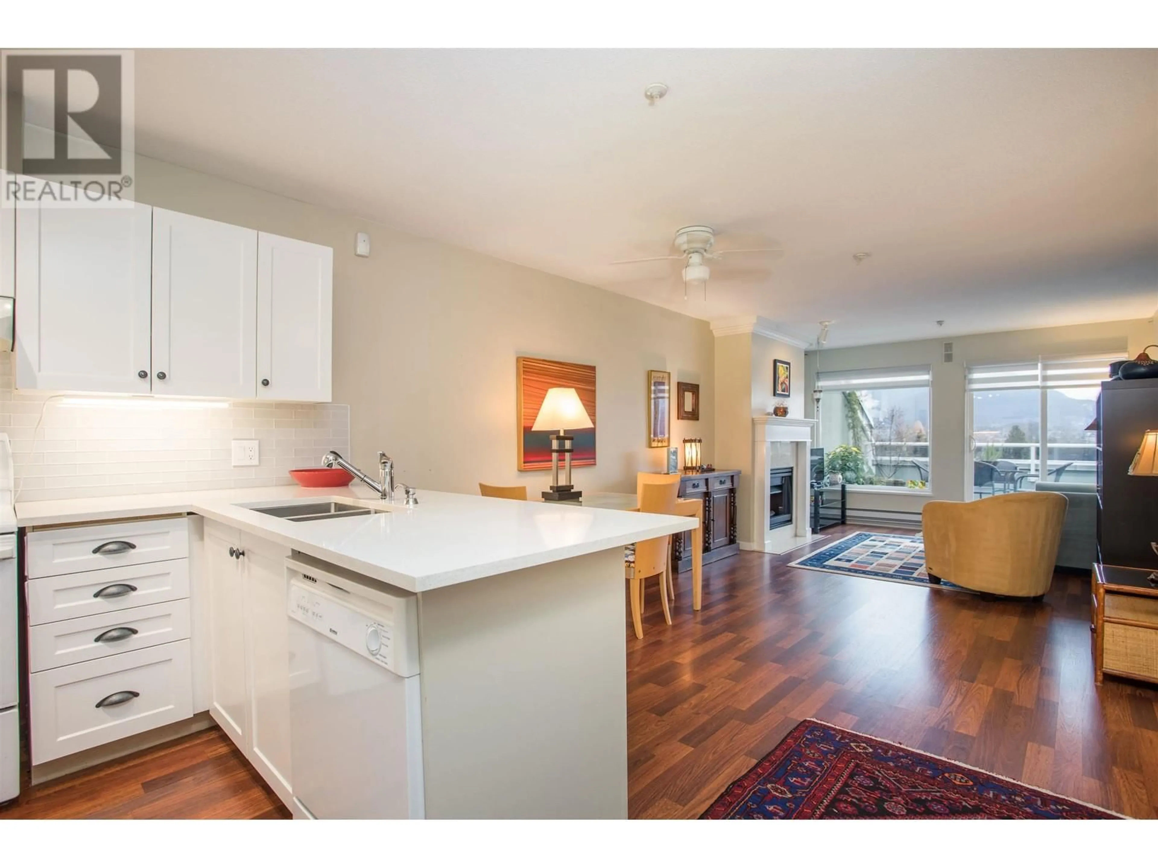 Open concept kitchen, wood/laminate floor for 403 315 RENFREW STREET, Vancouver British Columbia V5K5G5